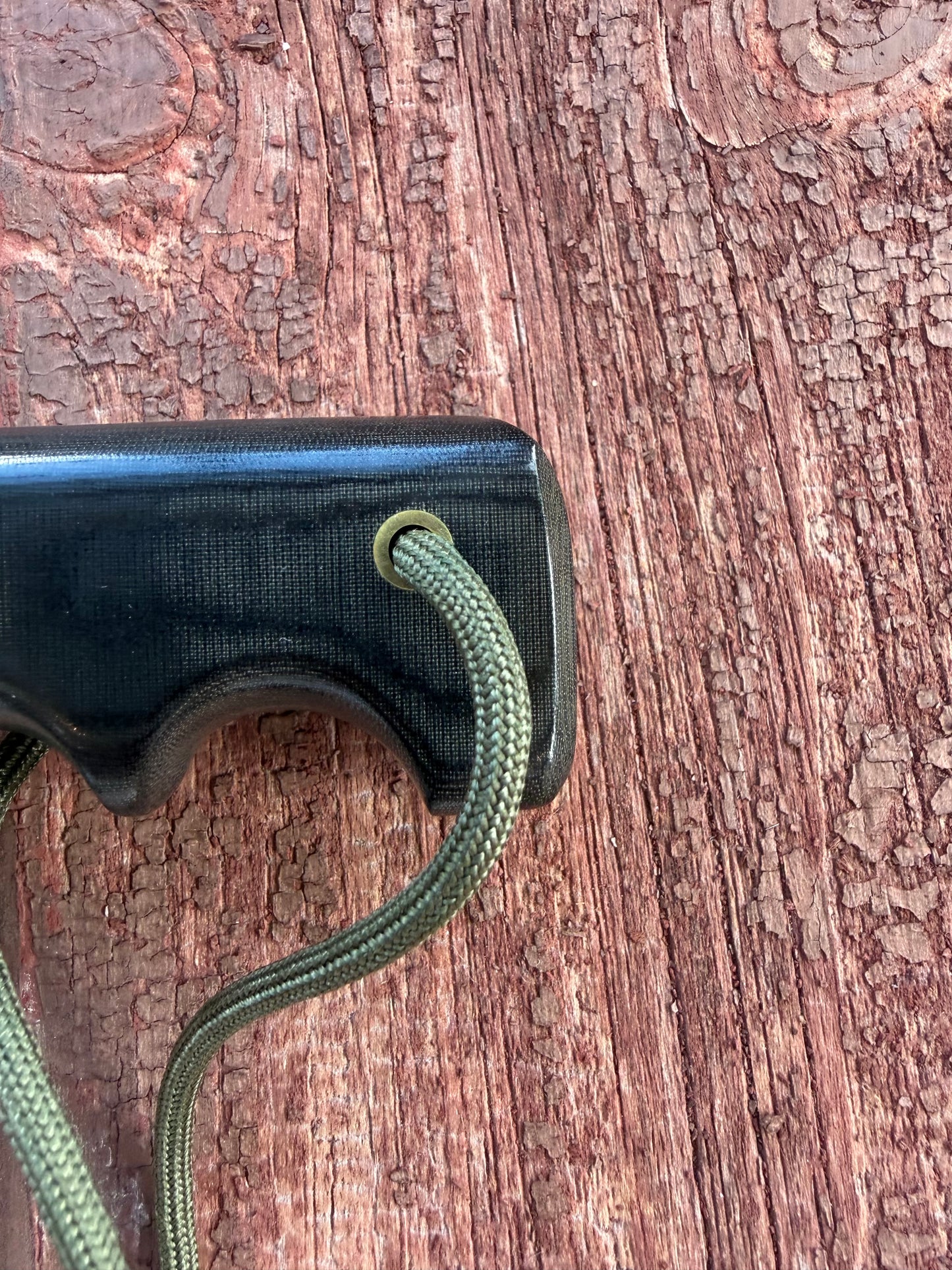 Randall Model 14-7.5 with a Black Micarta finger grooved handle. Stainless steel blade, Brass double hilt brown leather sheath.
