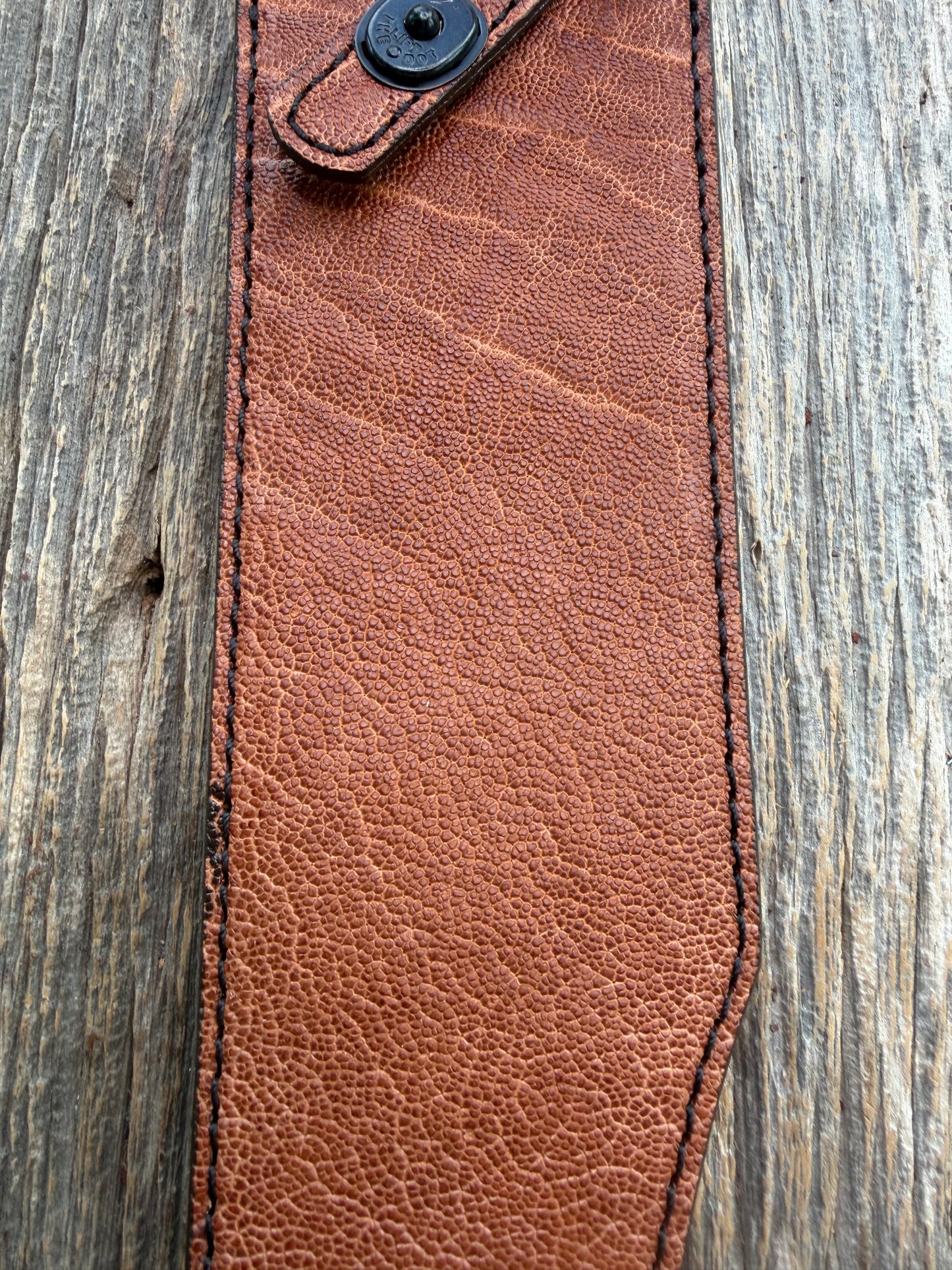 New Randall Model 12-11 Smithsonian Sheath in Exotic thick and textured Rust colored Elephant hide on brown leather from Treeman with a black Canteen snap. Hand tooled belt loop. Killer sheath.
