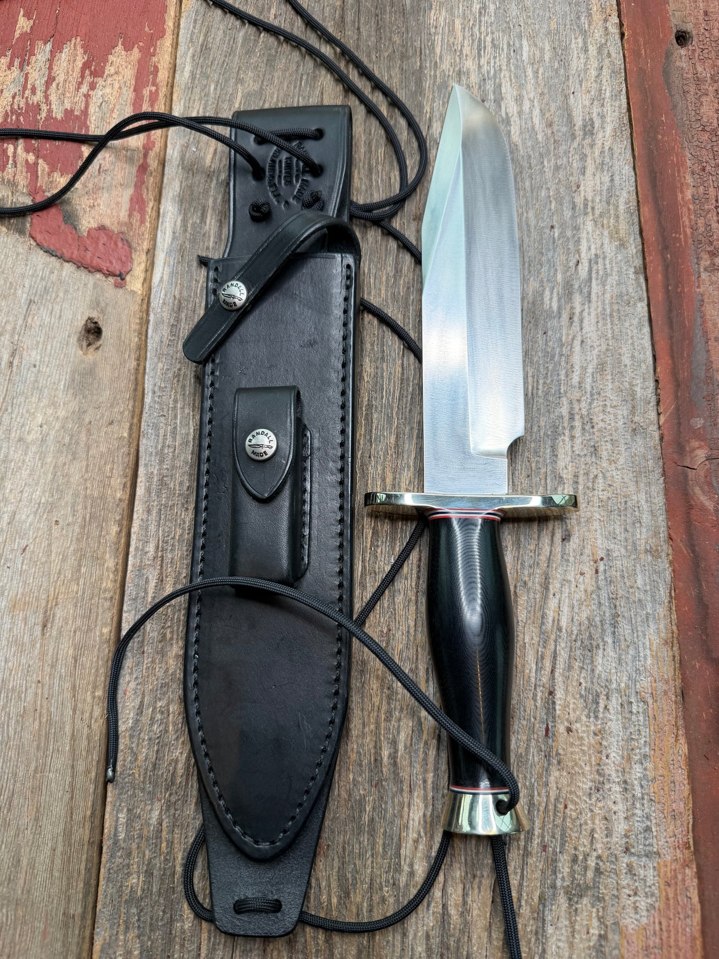 Nice Randall Model 12-9 in black Micarta handle. Red white and Blue spacers, Double Nickel Silver hilt, aluminum butt cap. Stainless blade.