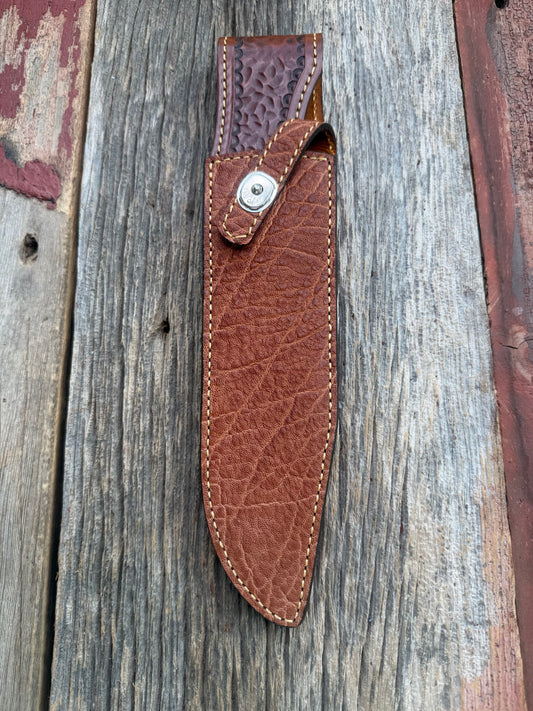 New Randall Model 12-9/14 Sheath in Exotic thick and textured Rust colored Elephant hide on brown leather from Treeman with a silver Canteen snap. Hand tooled belt loop. Killer sheath.
