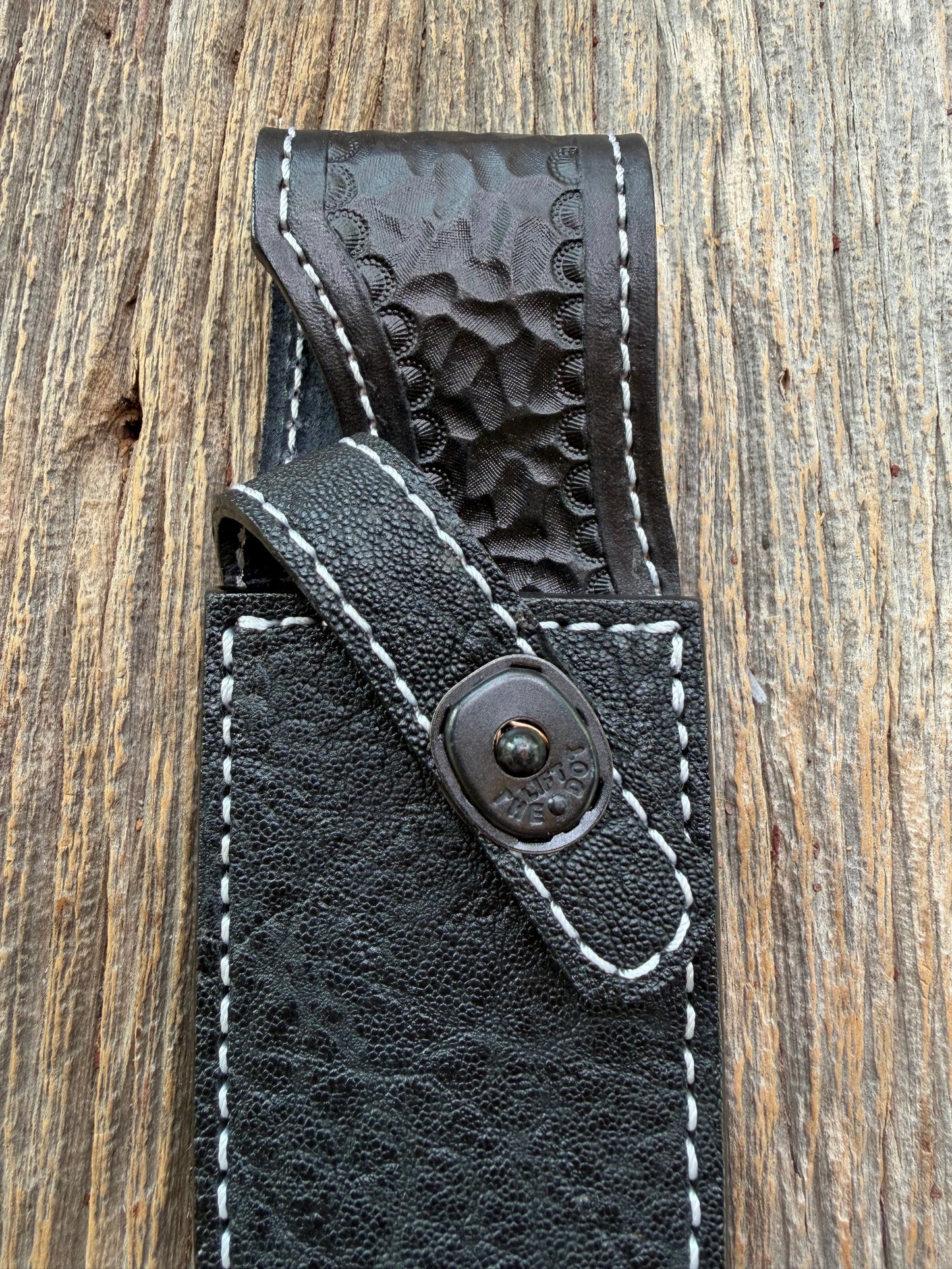 New Randall Model 11-5 Sheath in Exotic thick and textured Black Elephant hide on black leather from Treeman with a black Canteen snap. Hand tooled belt loop. Killer sheath.