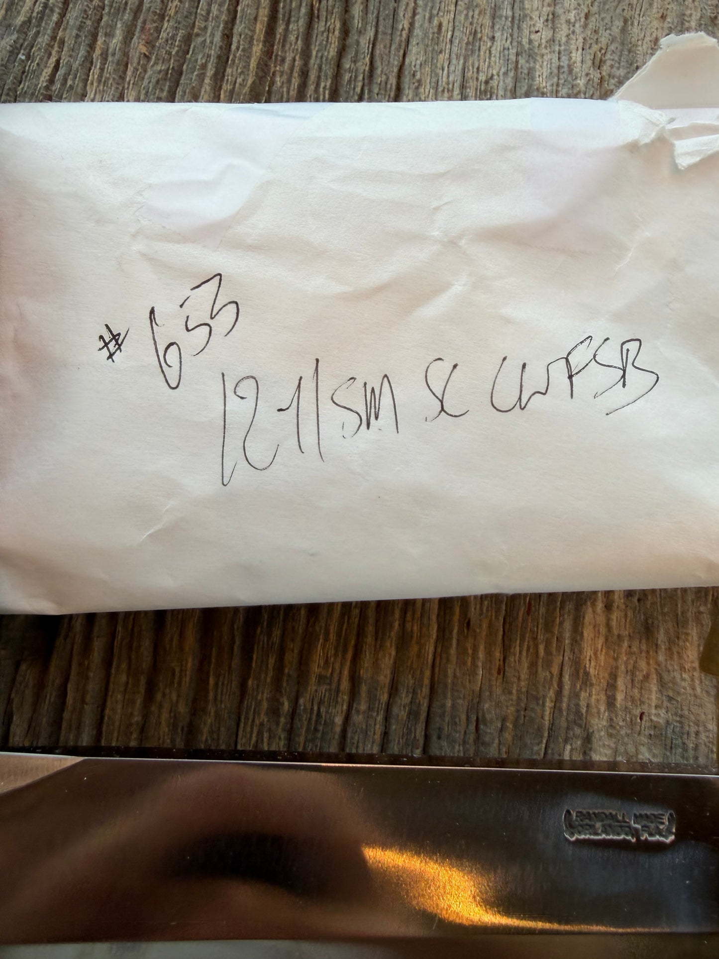 New in Paper Model 12-11 Smithsonian “ Smitty” Beautiful Dave Warthers Resin with a Brass Lugged hilt and Scalloped brass collar and scalloped coolie butt cap.