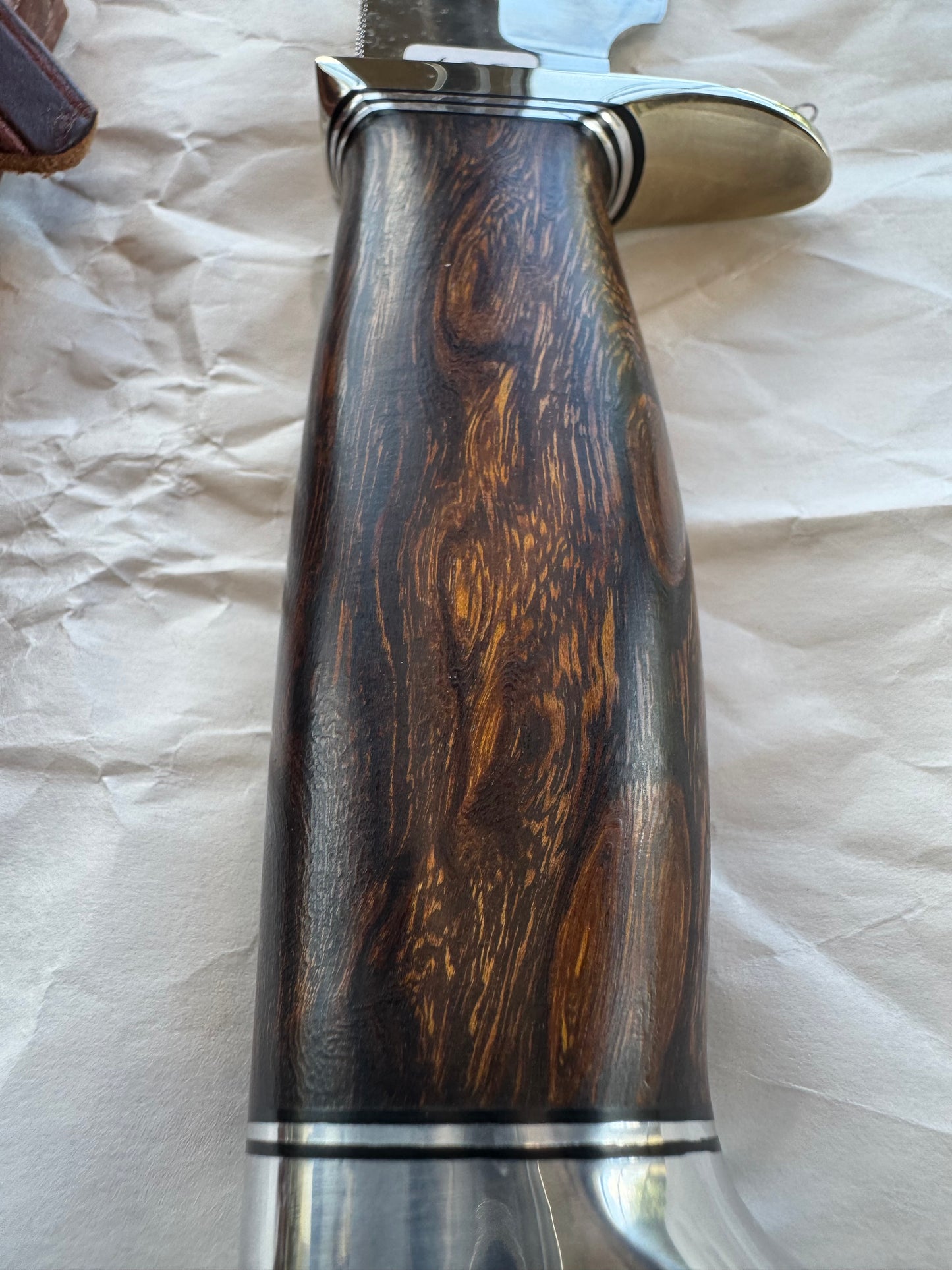 New in Paper Randall Model 19-5 Bushmaster with an Ironwood handle. SS blade, Nickel silver single hilt. Brown leather sheath.