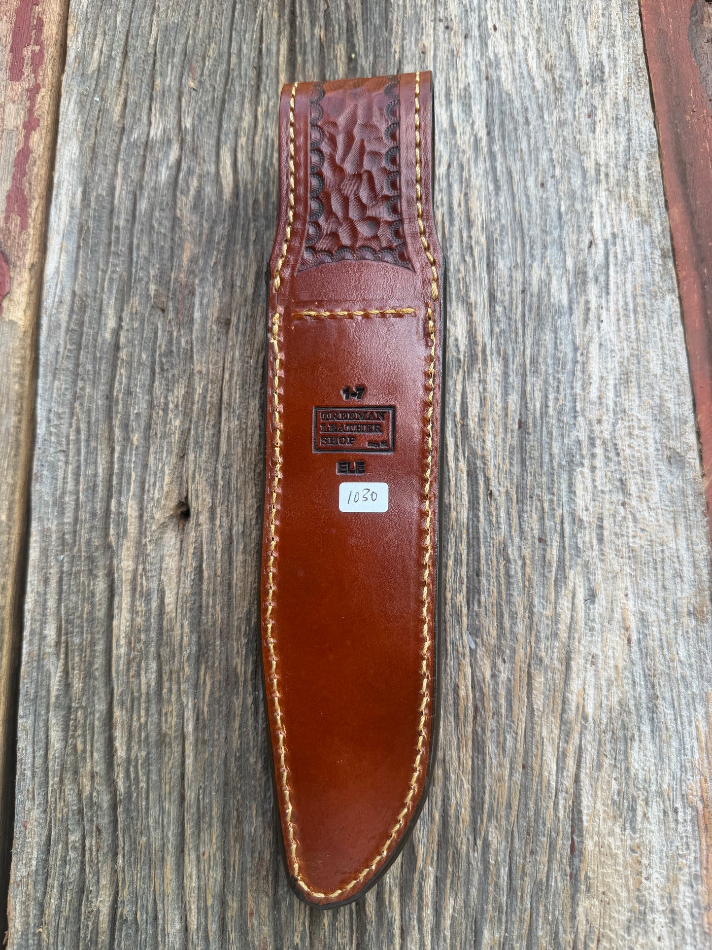 New Randall Model 1-7 Sheath in Exotic thick and textured Rust colored Elephant hide on brown leather from Treeman with a silver Canteen snap. Hand tooled belt loop. Killer sheath.