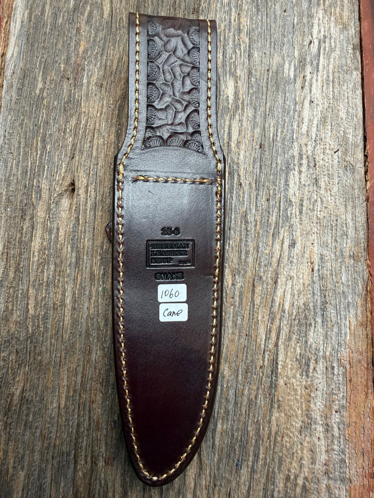 Randall Model 25-6 sheath with a Canebrake RattleSnake skin from Treeman Sheaths. Vibrant colors and along side Copperheads the hardest skin to source.