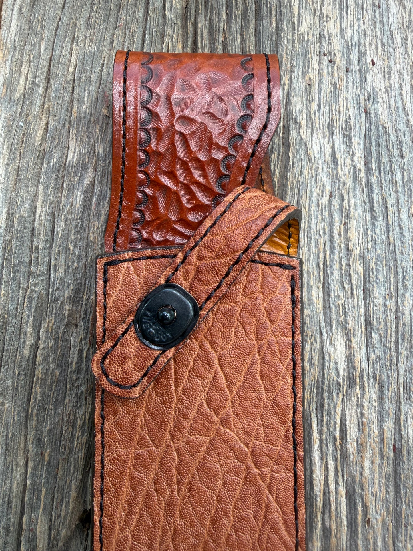 New Randall Model 12-11 Confederate Sheath in Exotic thick and textured Rust colored Elephant hide on brown leather from Treeman with a black Canteen snap. Hand tooled belt loop. Killer sheath.
