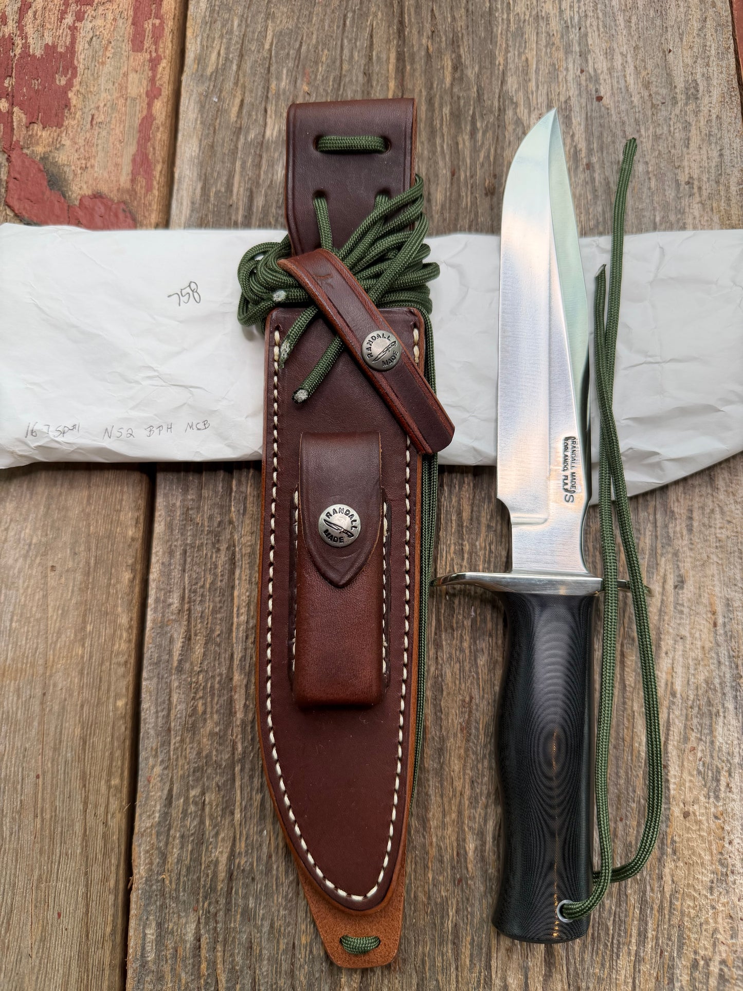 New in Paper Randall Model 16 SP#1 Special fighter with a Black Micarta handle. SS blade, Nickel silver hilt. Lanyard. Brown leather sheath.