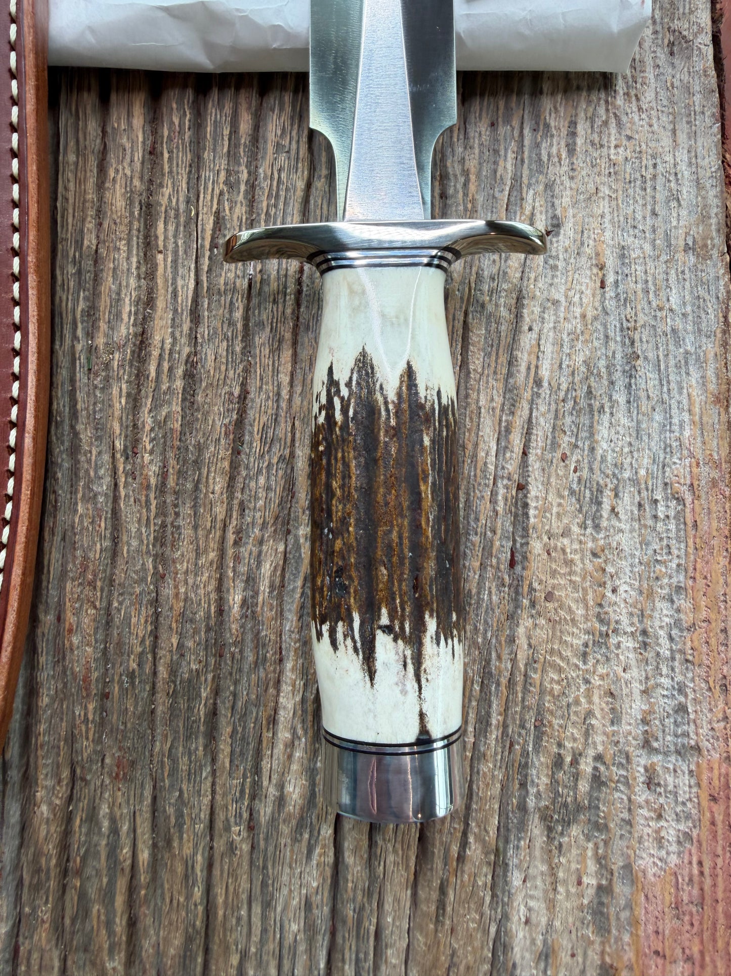 New in Paper Randall Made Knife Model 2-7 with a Stag handle, Stainless steel blade, Nickel silver Hilt, black and aluminum spacers, loaded!!