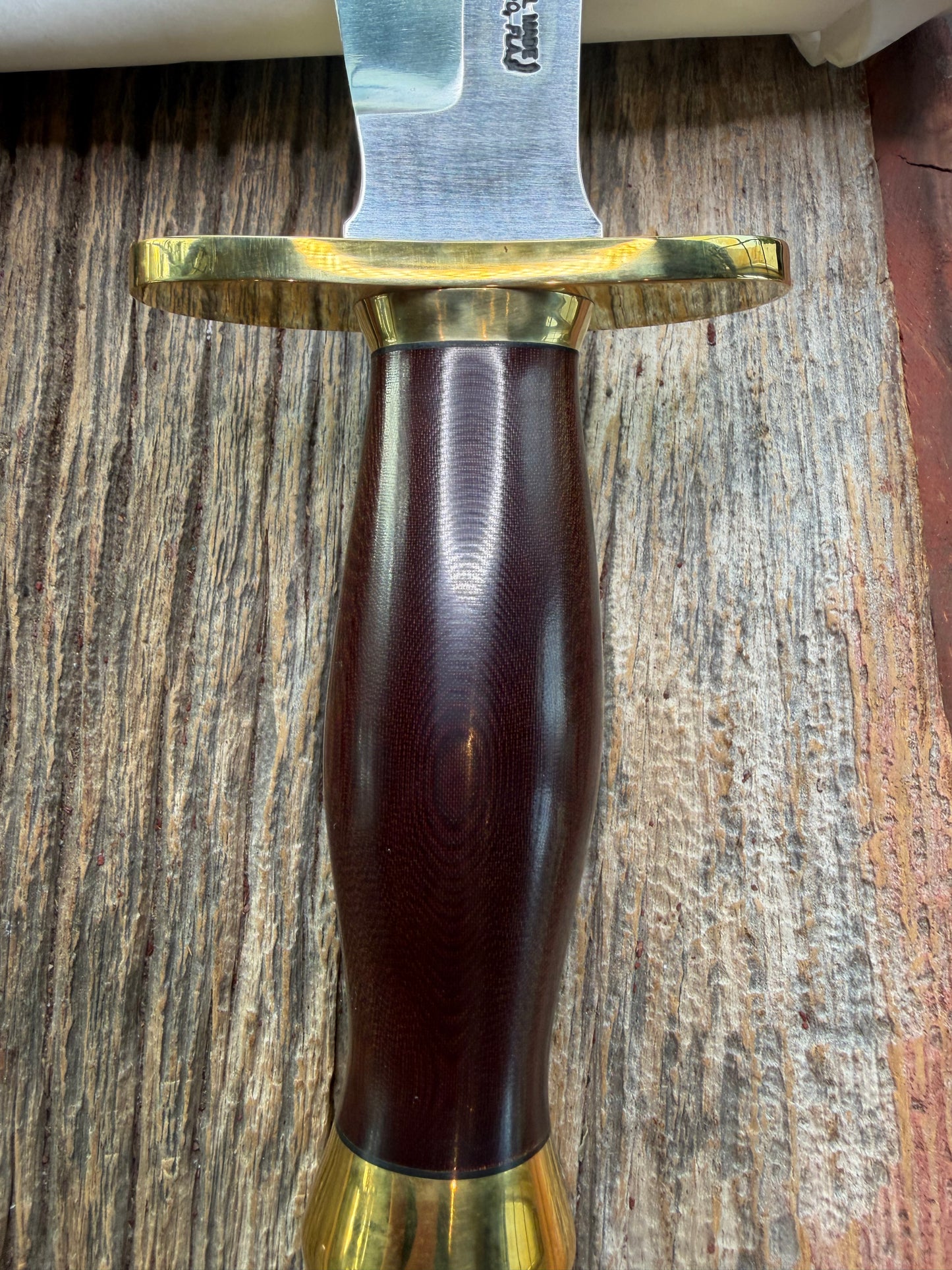 New in Paper Randall Model 12-8 Big Bear with a Maroon Micarta handle. Brass Hilt  and Brass collar, Carbon steel, brass butt cap.