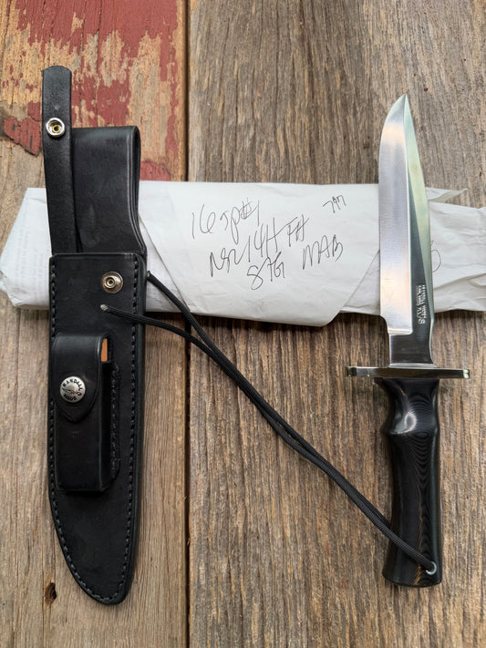 New in Paper Randall Model 16 SP#1 Special fighter with a Black Micarta handle. SS blade, Nickel silver Double hilt. Lanyard. Brown leather sheath.