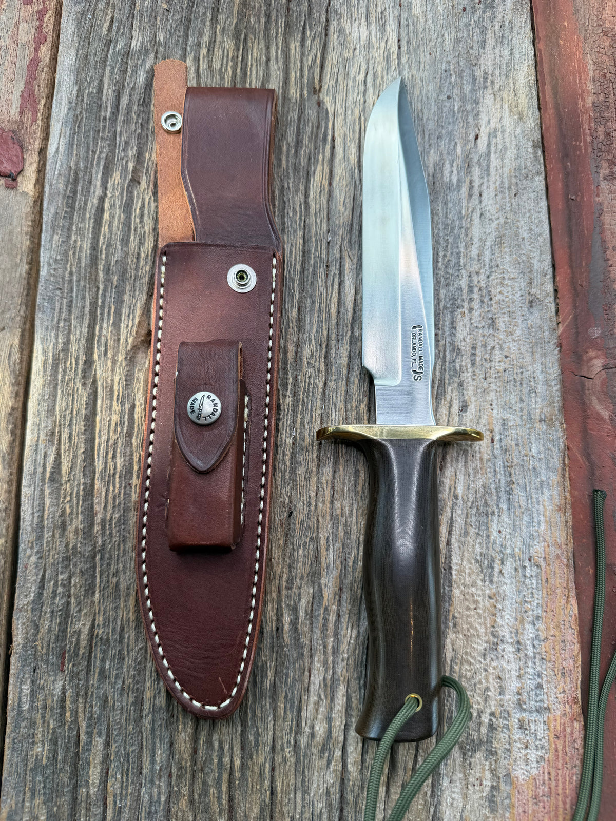Nice Randall Model 16 SP#1 Special fighter with a Brown Micarta handle. SS blade, brass hilt. Lanyard. Brown leather sheath.