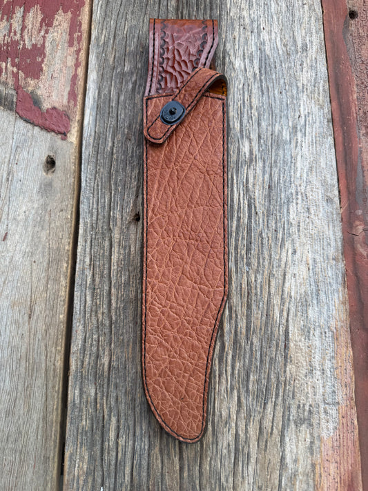 New Randall Model 12-11 Confederate Sheath in Exotic thick and textured Rust colored Elephant hide on brown leather from Treeman with a black Canteen snap. Hand tooled belt loop. Killer sheath.