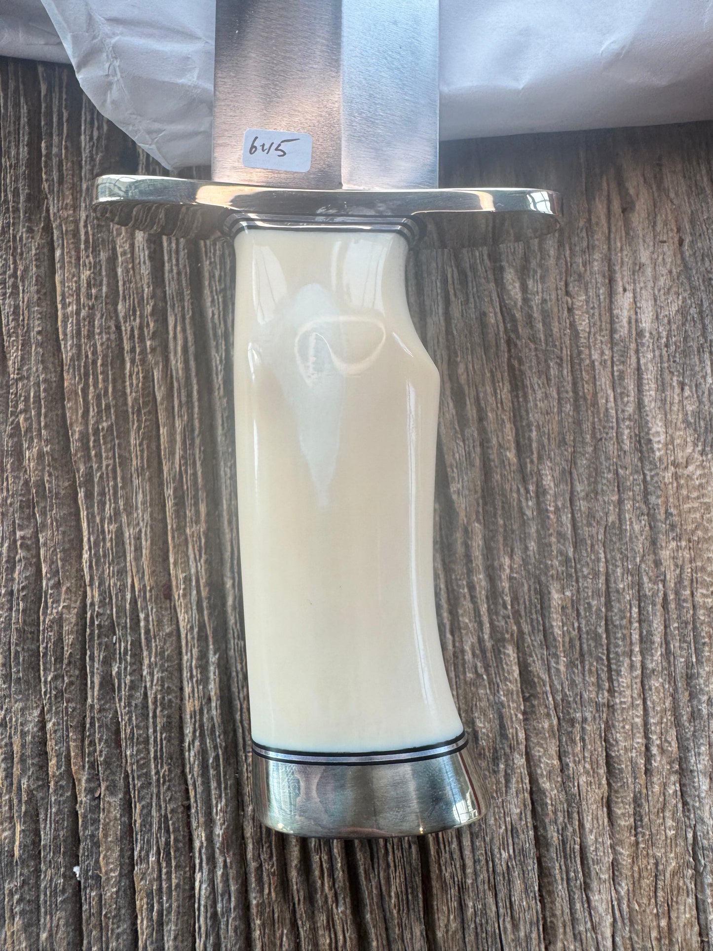 New in Paper Model 12-11 Smithsonian “Smitty” Bowie. Beautiful creamy Fossil Walrus Ivory with a single finger grip and a Nickel  Silver forward curved hilt and butt cap. Unreal Scrim opportunity!! Blank Canvas..