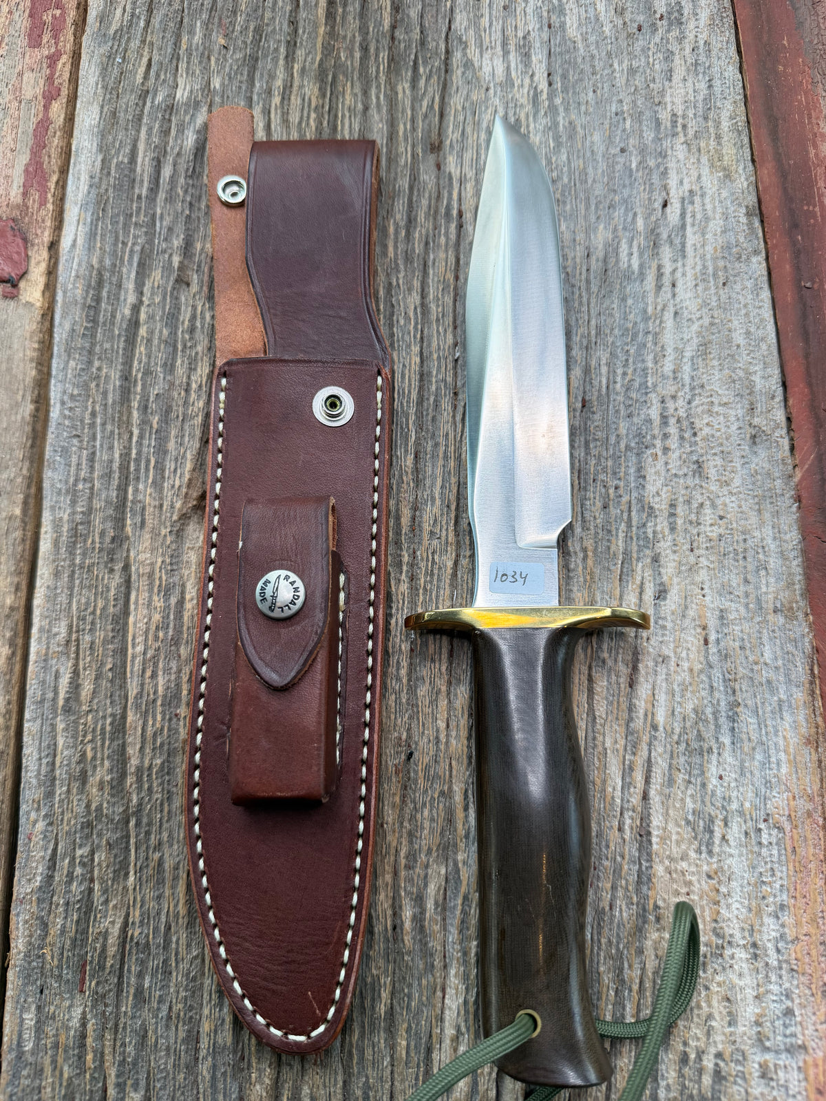 Nice Randall Model 16 SP#1 Special fighter with a Brown Micarta handle. SS blade, brass hilt. Lanyard. Brown leather sheath.