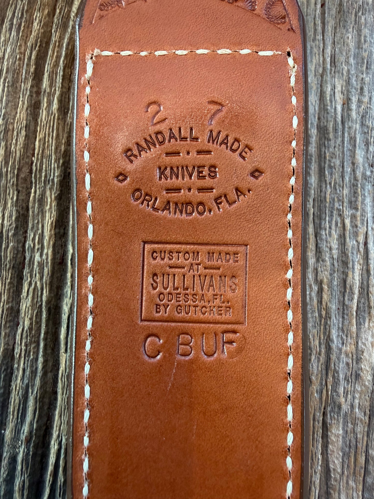 New Randall Model 2-7 Sheath in Exotic Brown Cape Buffalo with full leather hand tooled belt loop. Randall snap and stamp on the back. Custom Made at Sullivan’s by Gutcher