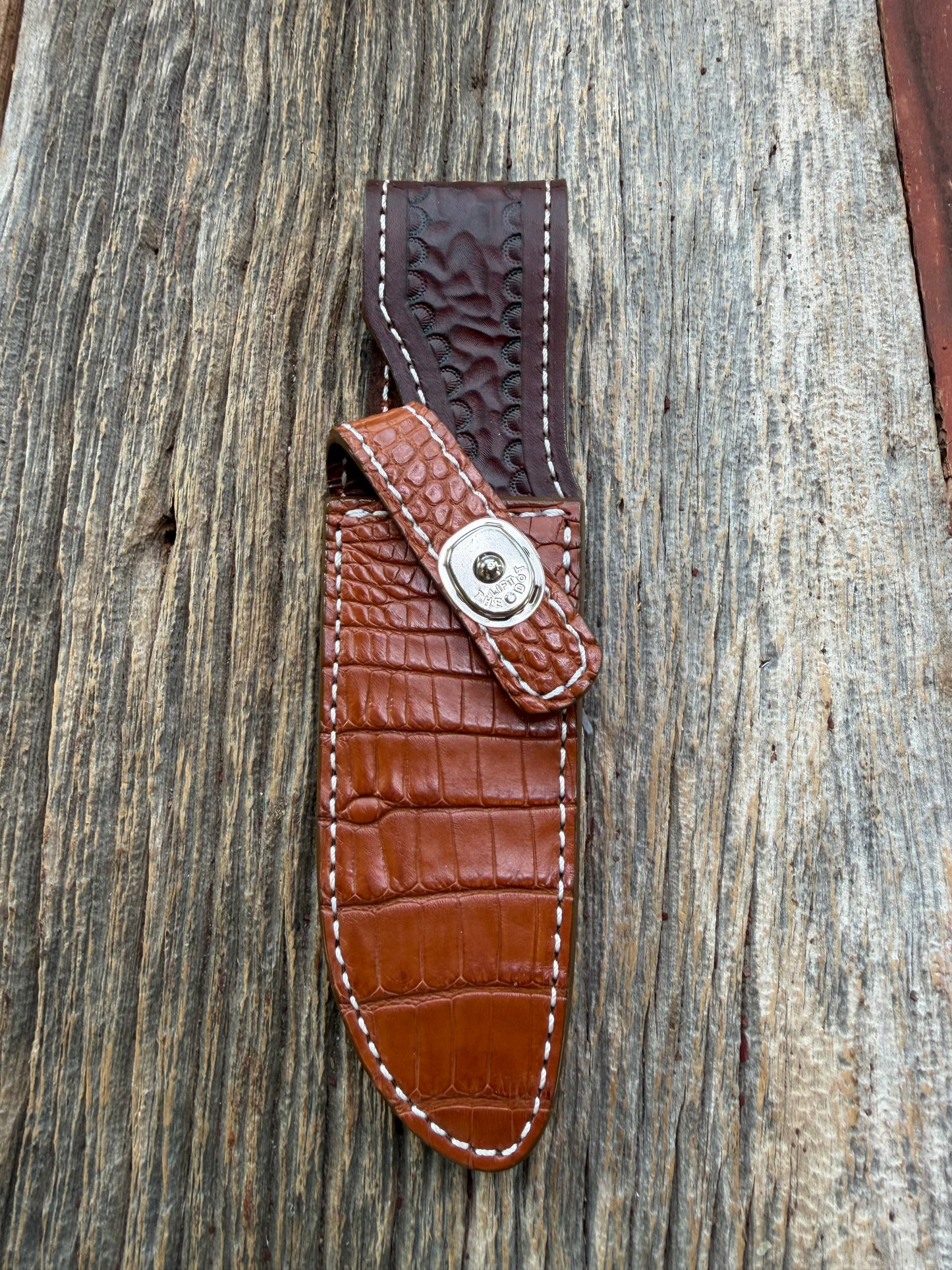 New Randall Model 23 Sheath in Exotic thick and textured Honey Crocodile skin on brown leather from Treeman with a silver Canteen snap. Hand tooled belt loop. Killer sheath.