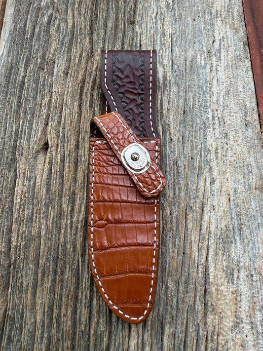 New Randall Model 23 Sheath in Exotic thick and textured Honey Crocodile skin on brown leather from Treeman with a silver Canteen snap. Hand tooled belt loop. Killer sheath.