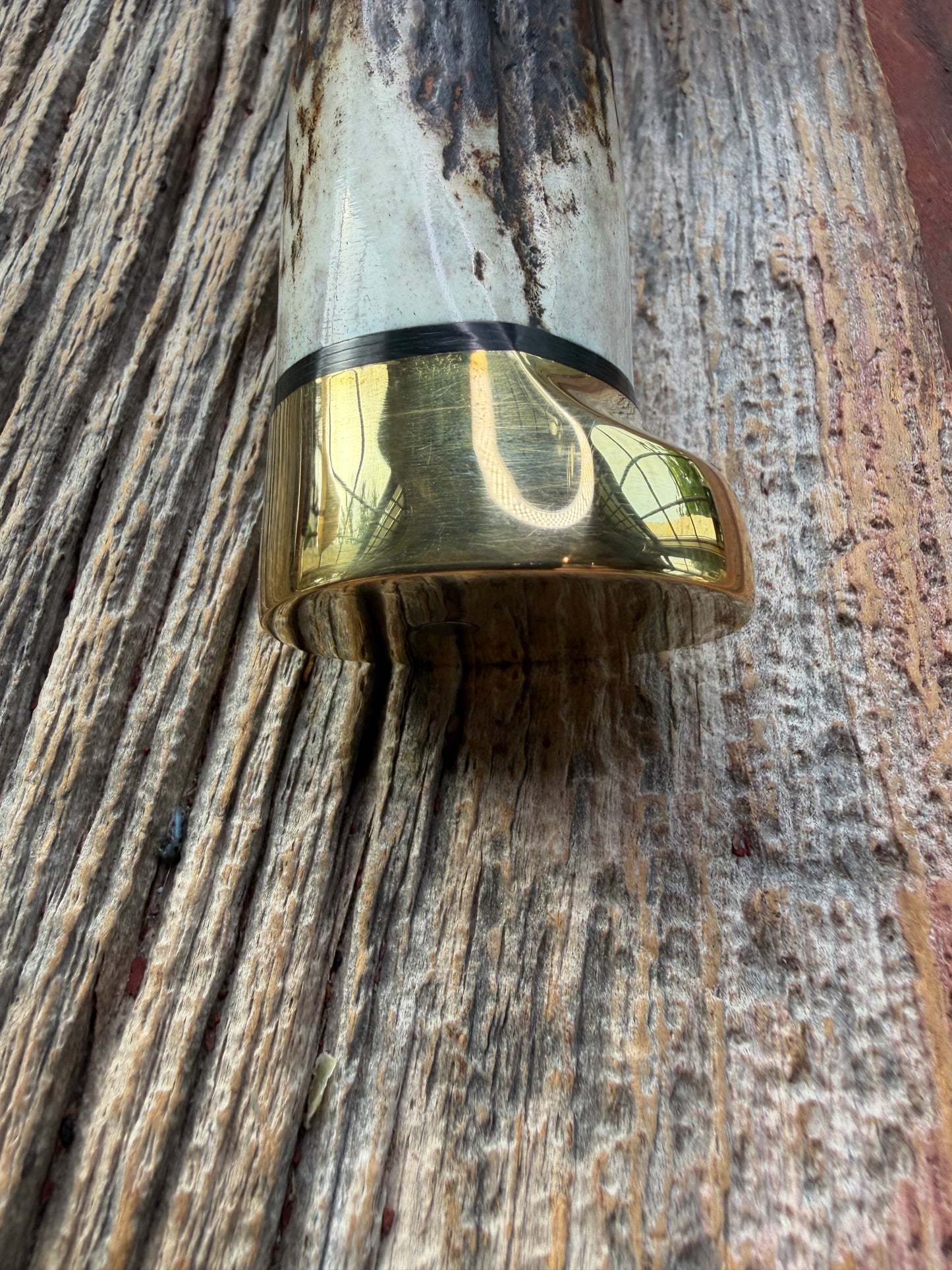 New in paper fresh from the Shop. Randall Knife Model 14-7.5 Big. Nice piece of Stag, Gorgeous Brass Lugged hilt and brass crows beak butt cap. Single black spacer. Stainless steel.