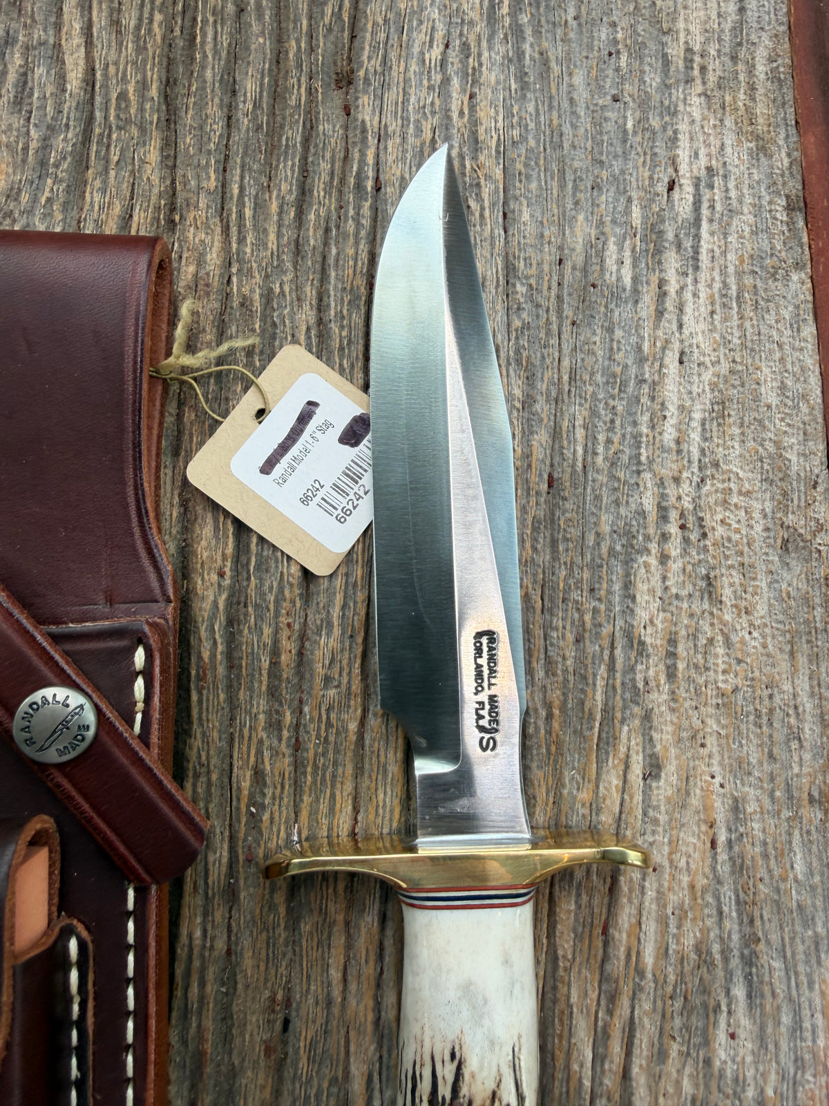 New Randall Model 1-6 with a Stag handle. Stainless steel blade, brass hilt and natural butt. Red white and Blue spacers.