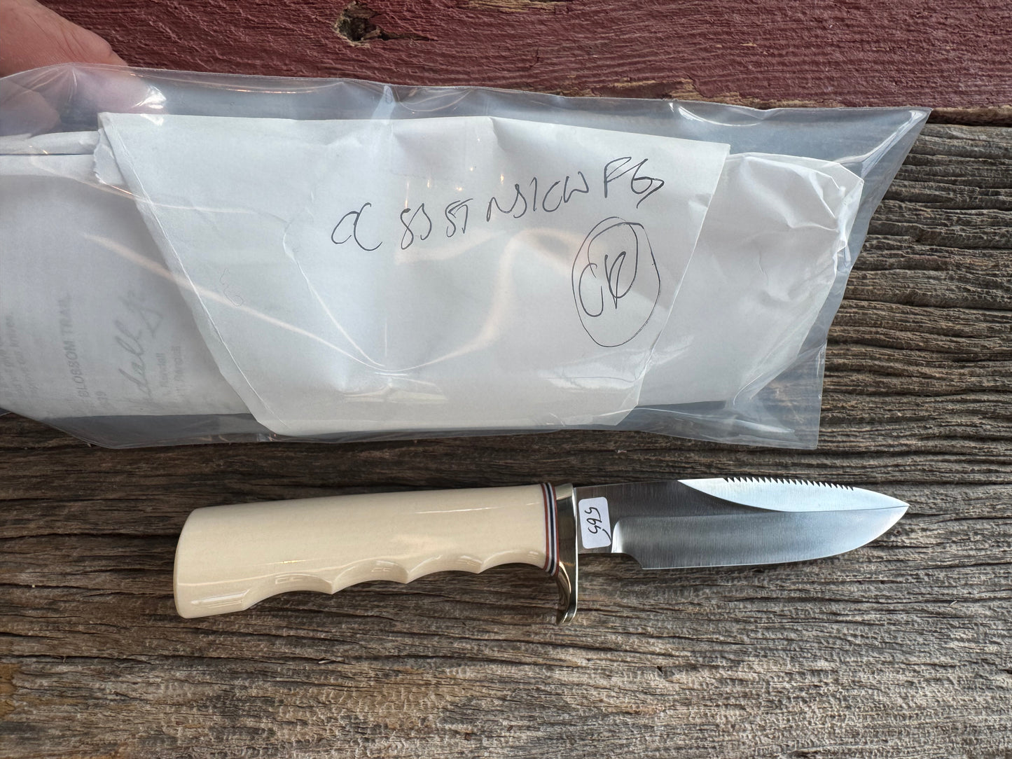 Randall Model Combat Companion with a nice piece of customer supplied Warthers Resin with finger grooves. Teeth, Stainless Steel, Nickel Silver Hilt and a raw natural end.