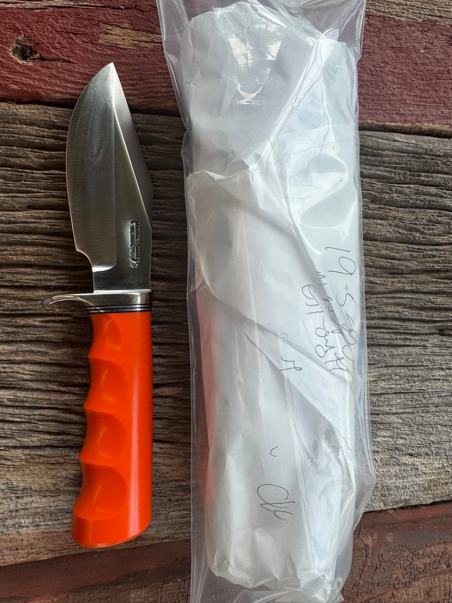 New in paper Randall Model 19-5 with a nice piece of customer supplied Orange G10 with finger grooves. Stainless Steel, Nickel Silver Hilt and a raw natural end.