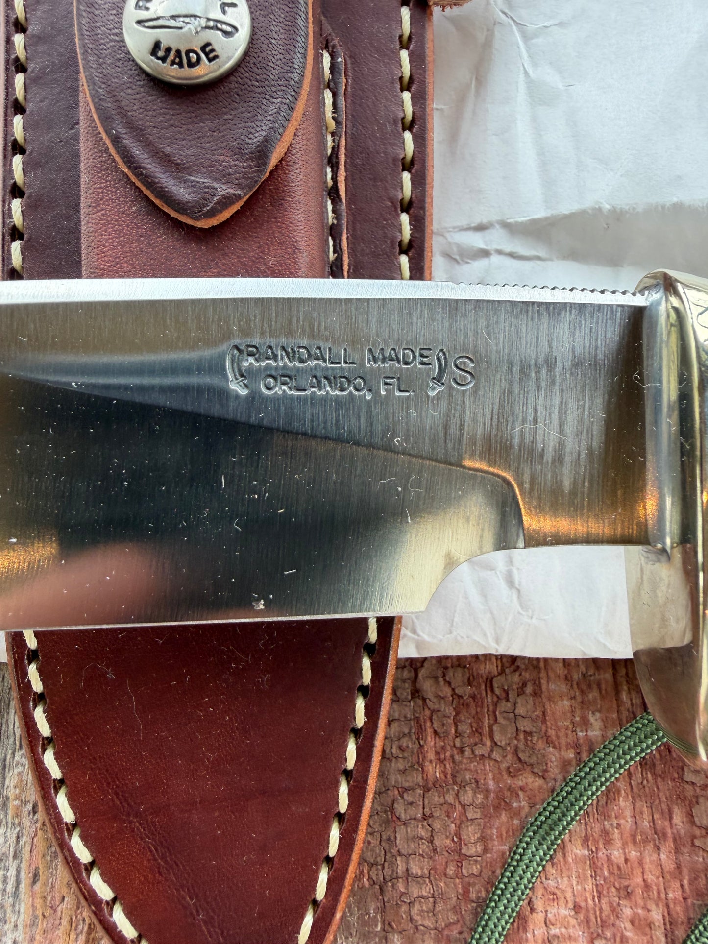 New in paper Randall Knife Model 25-6 Trapper in Stag Leather Handle Stainless Blade, nickel silver hilt , wrist thong.