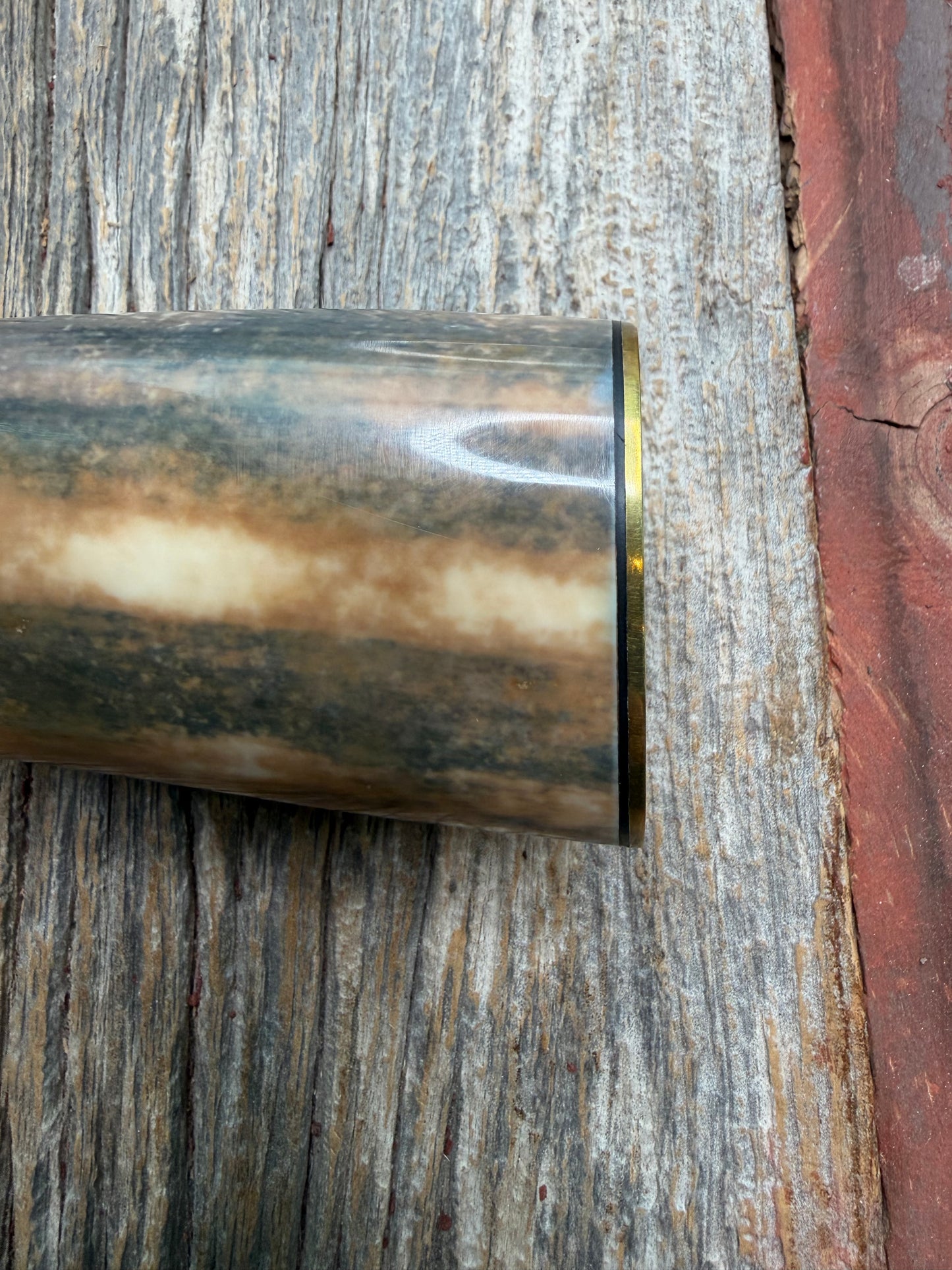 Randall Model 12-11 Smithsonian “Smitty” in a Huge piece of Green, Brown and Blue Fossil Walrus Ivory. Brass Hilt and Brass Butt plate fully engraved in Silver from Jere Davidson.  Stunning piece.