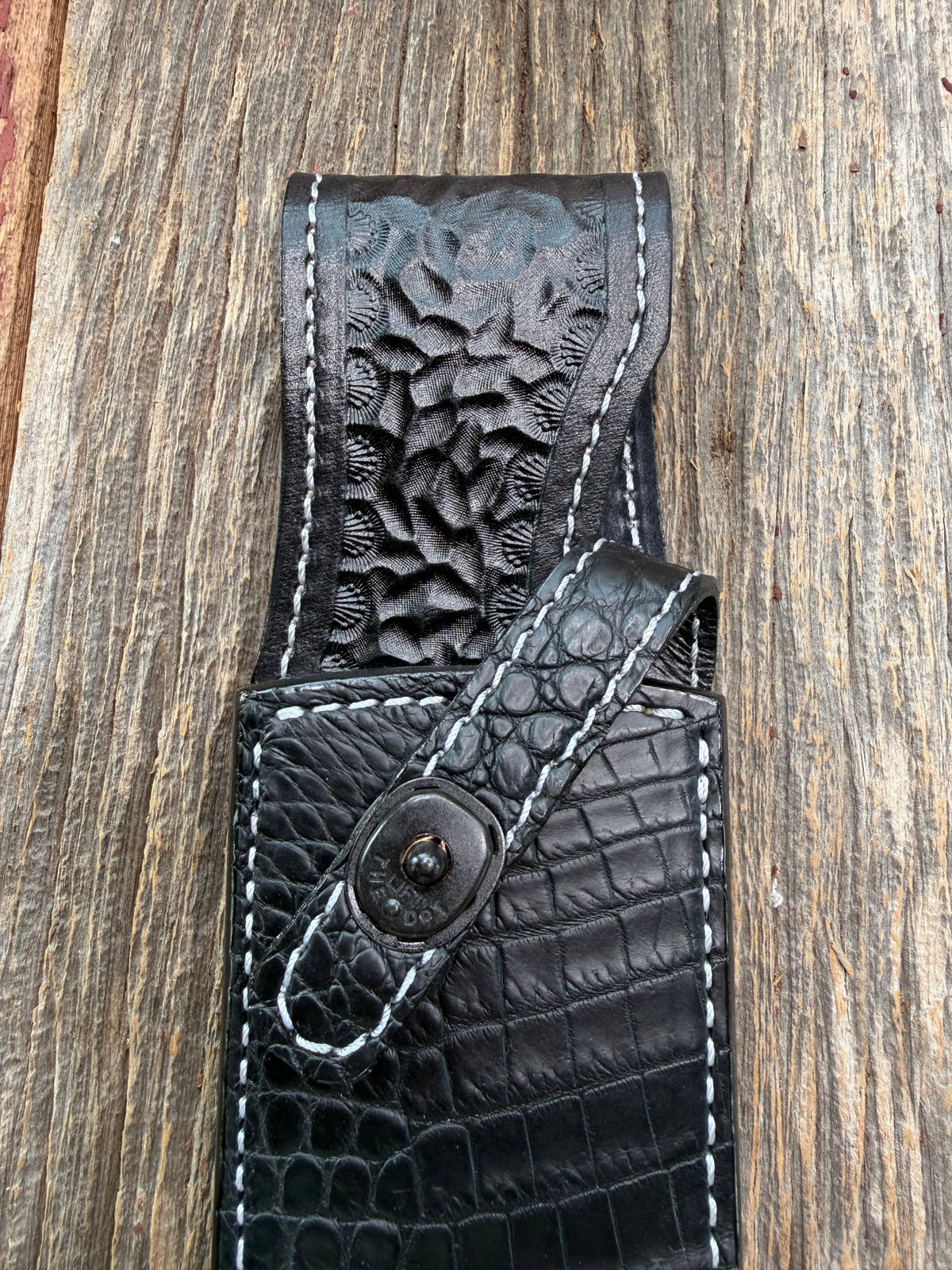 New Randall Model 12-9 Sheath in Exotic Black Matte Crocodile from Treeman with a Black Canteen snap. White thread deviated stitching on black leather..Killer sheath.