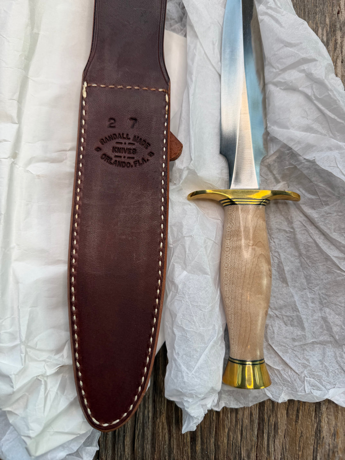 New in Paper Randall Made Knife Model 2-7 Maple wood, Stainless, Black and gold spacers, Brass Hilt and  butt cap.