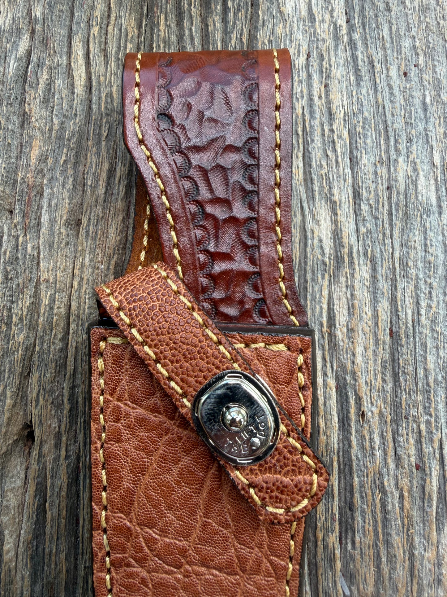 New Randall Model 27 Sheath in Exotic thick and textured Rust colored Elephant hide on brown leather from Treeman with a silver Canteen snap. Hand tooled belt loop. Killer sheath.
