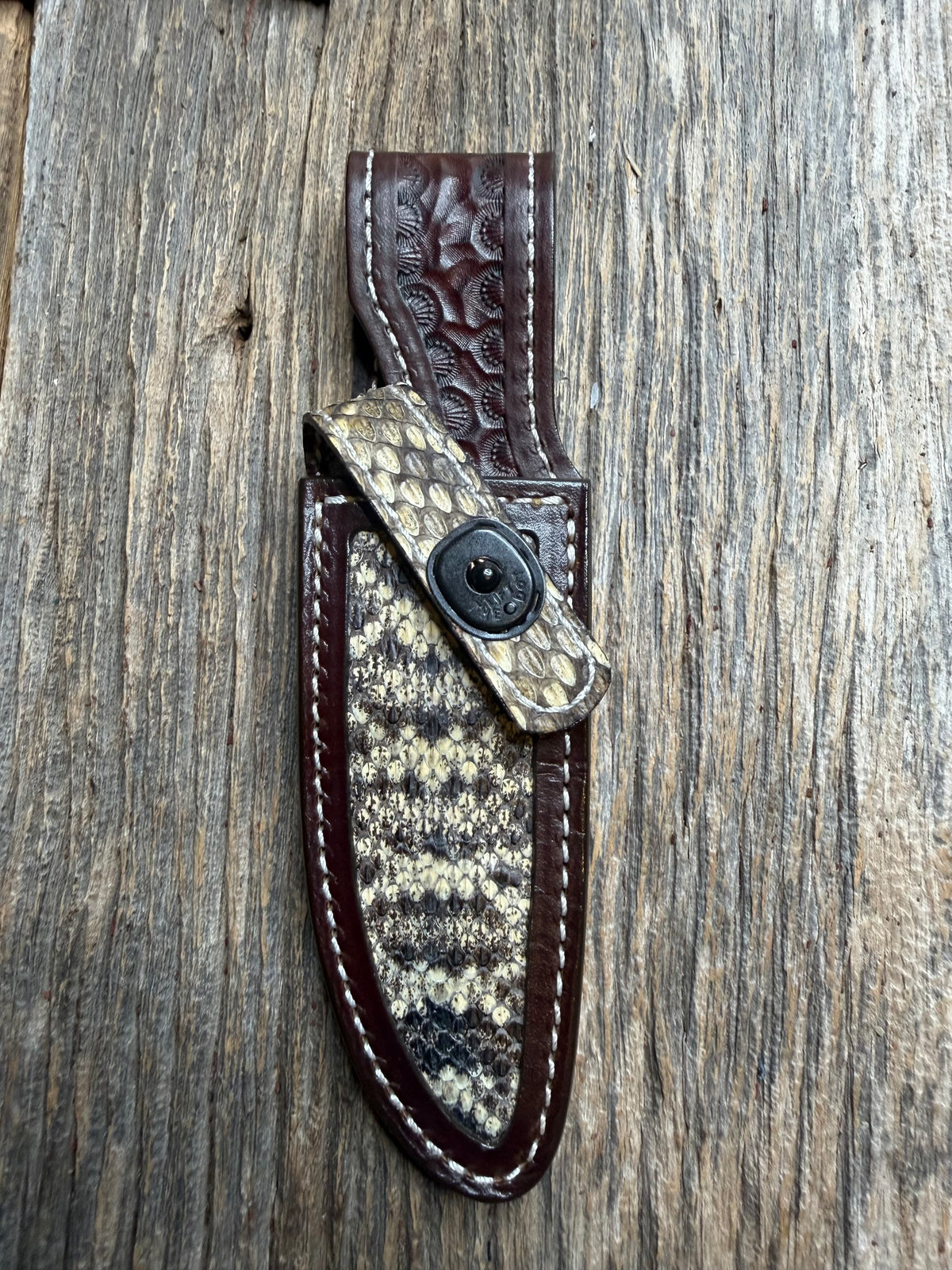 Randall Model 28 sheath with an Eastern Diamondback RattleSnake skin from Treeman Sheaths. Hand tooled belt loop, canteen snap. Vibrant colors and one of the hardest skins to source.
