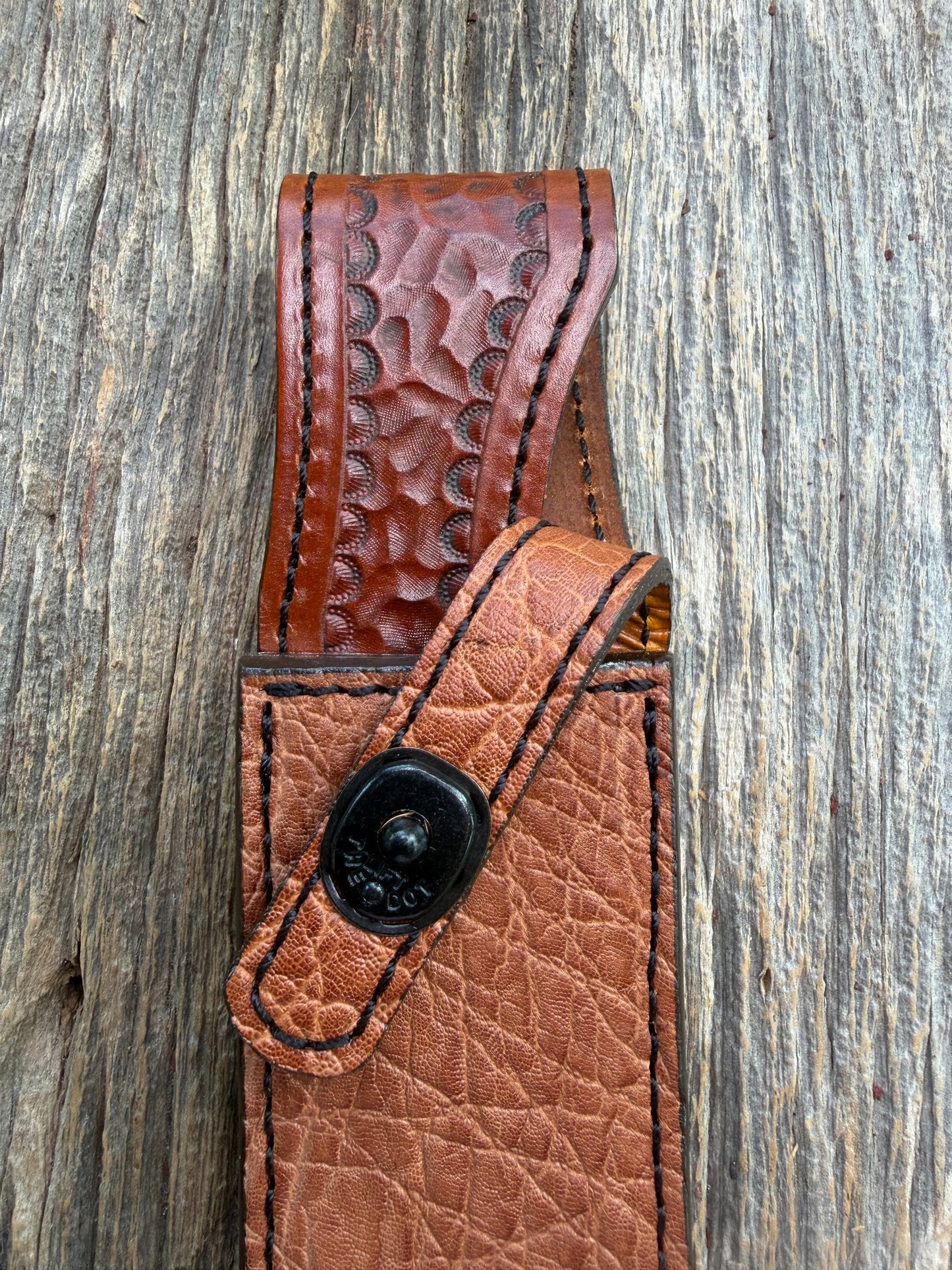 New Randall Model 1-8 Sheath in Exotic thick and textured Rust colored Elephant hide on brown leather from Treeman with a black Canteen snap. Hand tooled belt loop. Killer sheath.
