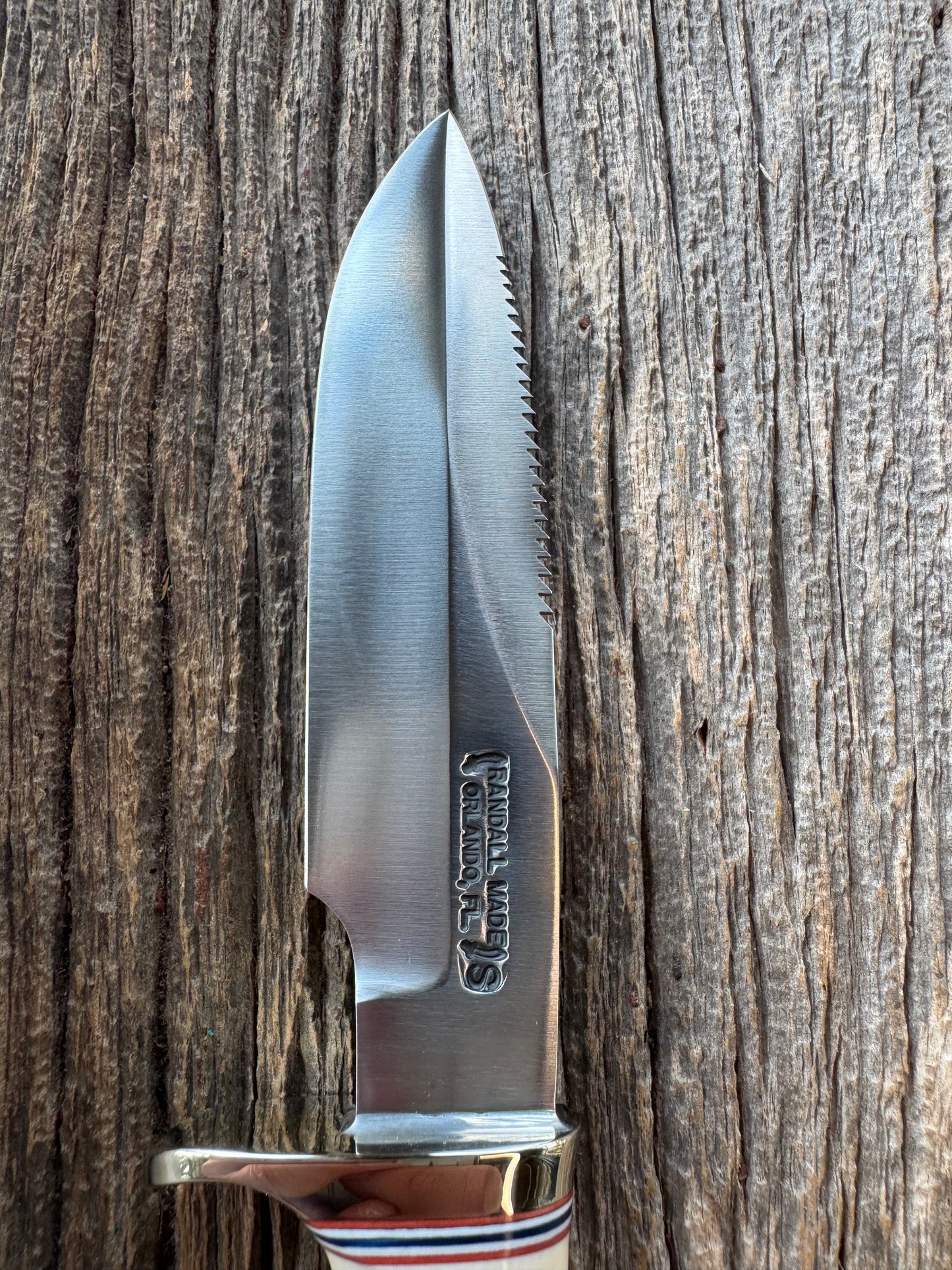 Randall Model Combat Companion with a nice piece of customer supplied Warthers Resin with finger grooves. Teeth, Stainless Steel, Nickel Silver Hilt and a raw natural end.