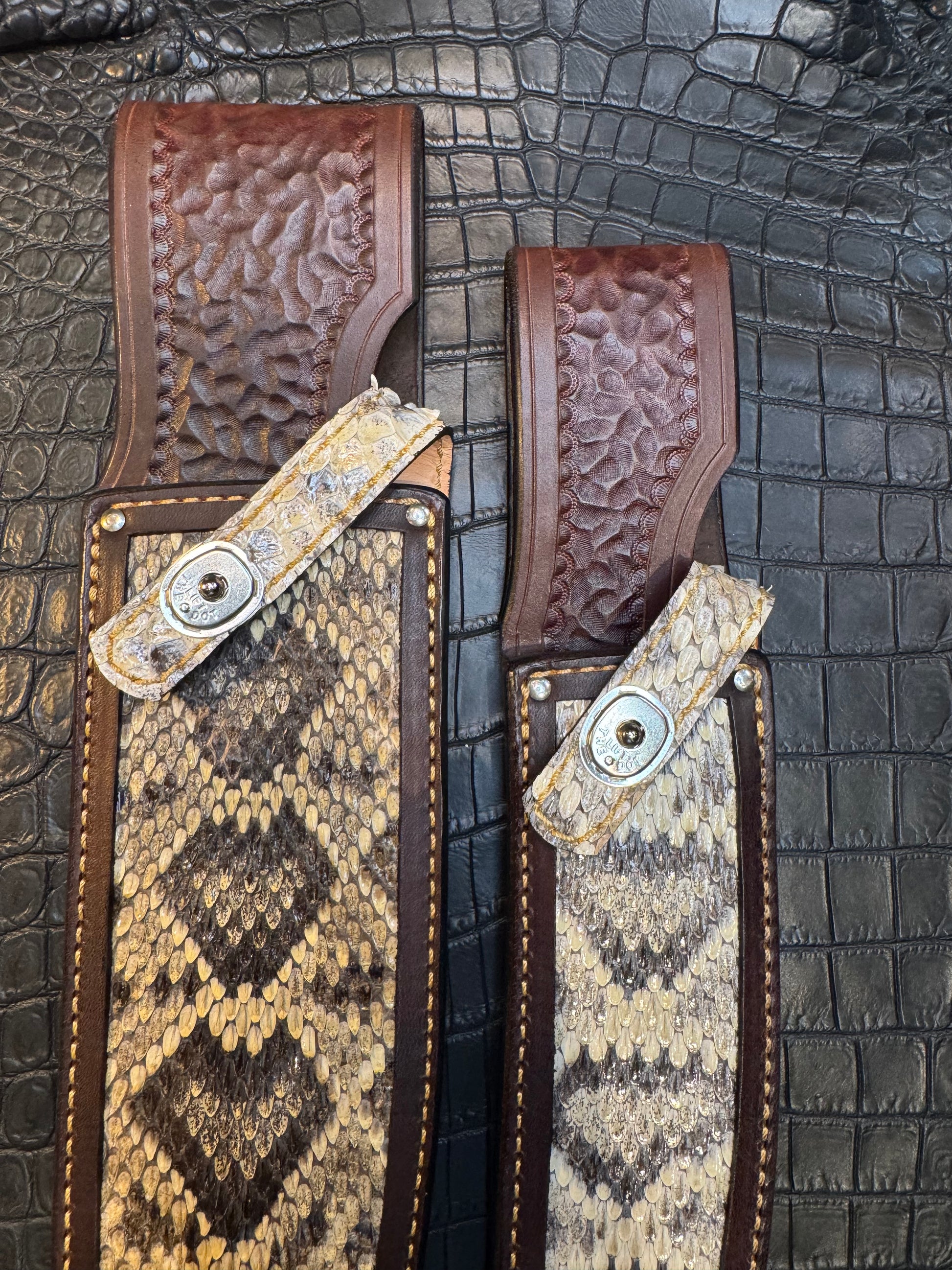 A pair of Randall Model 12-11 Large Sasquatch and Randall Model 12-8 Small Sasquatch Sheaths in Exotic Vibrant Diamond Pattern Rattlesnake skin by Treeman.