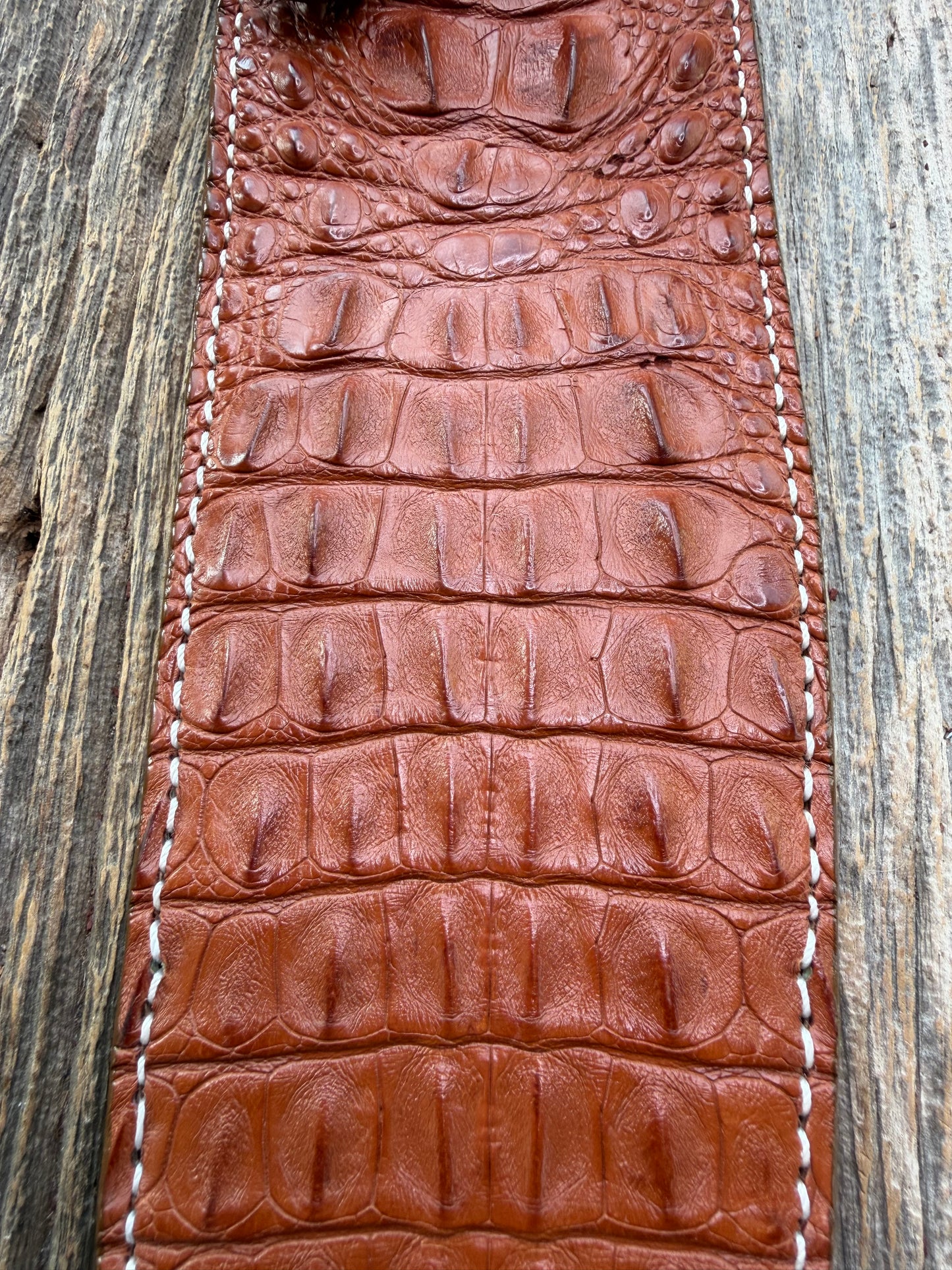New Randall Model 12-11 Large Sasquatch Sheath in Exotic thick and textured Honey Crocodile skin ( skull portion) on brown leather from Treeman with a silver Canteen snap. Hand tooled belt loop. Killer sheath.