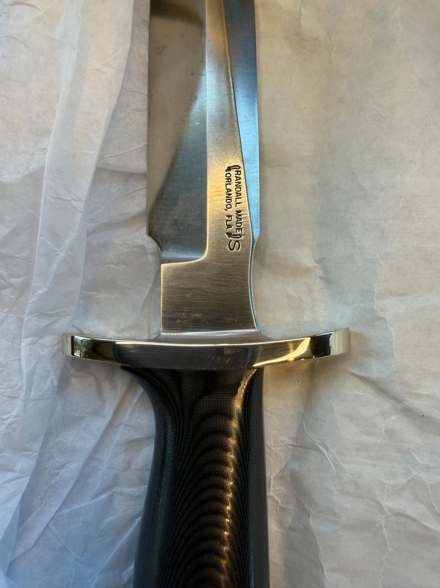 New in Paper Randall Model 16 SP#1 Special fighter with a Black Micarta handle. SS blade, Nickel silver Forward Curved hilt. Lanyard. Brown leather sheath.