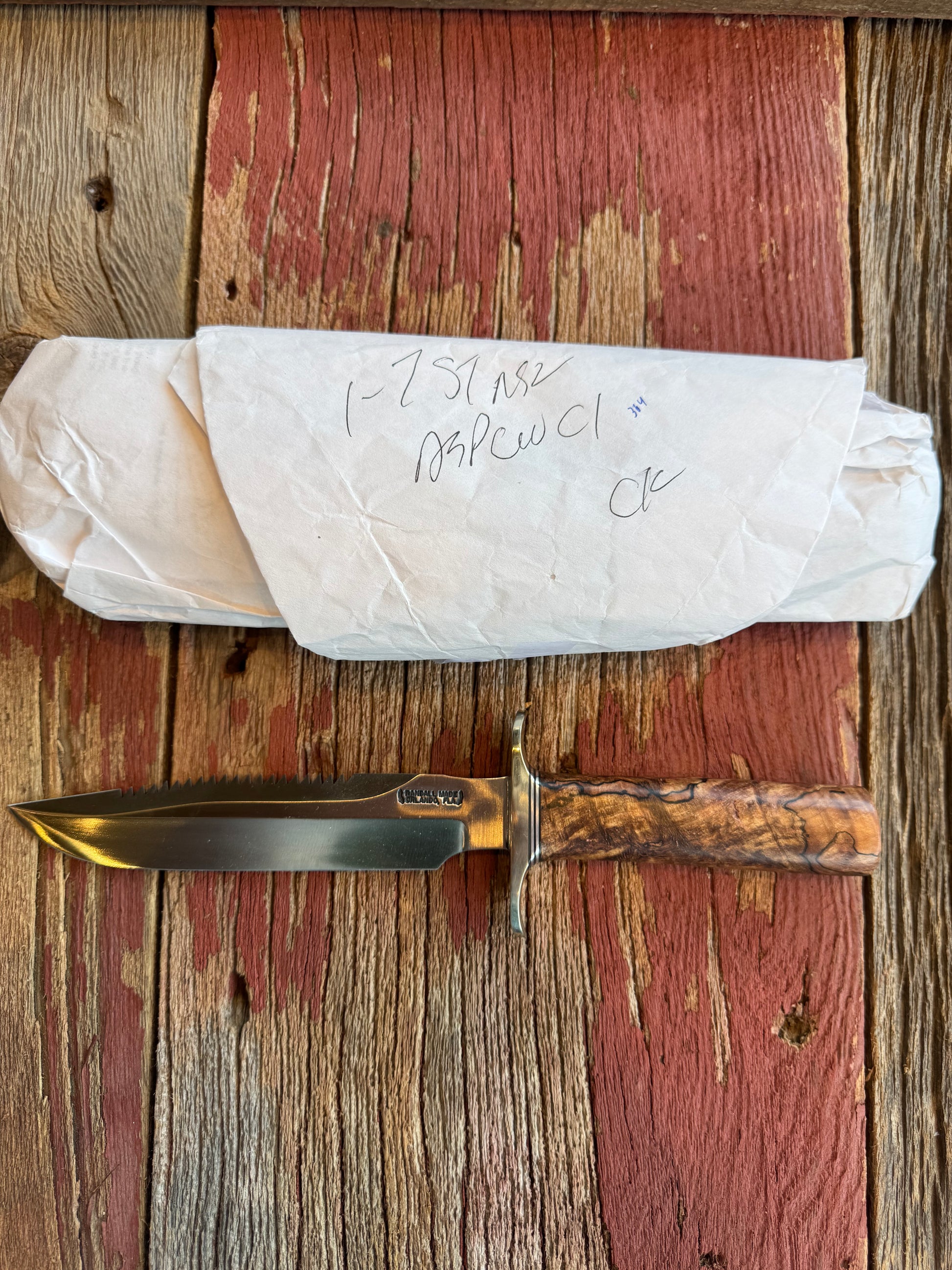 New in paper Randall Knife Model 1-7 Spalted Ebony wood Handle. Carbon Steel Blade, compass and Sawteeth.