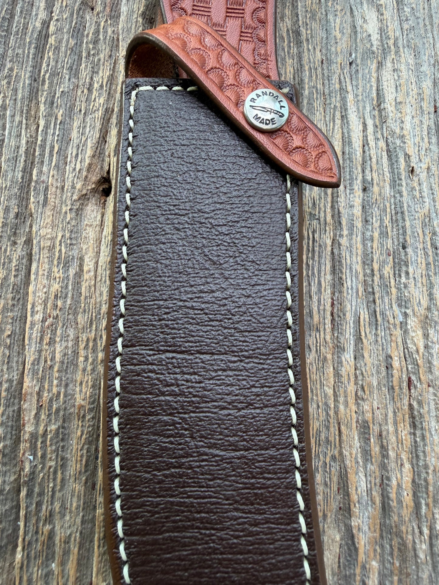 Pristine Randall Model 4-7 sheath in Exotic Cape Buffalo leather from Sullivans by Gutcher. Heavily tooled belt loop and strap. Randall snap and clean stamping on the back … perfect!!