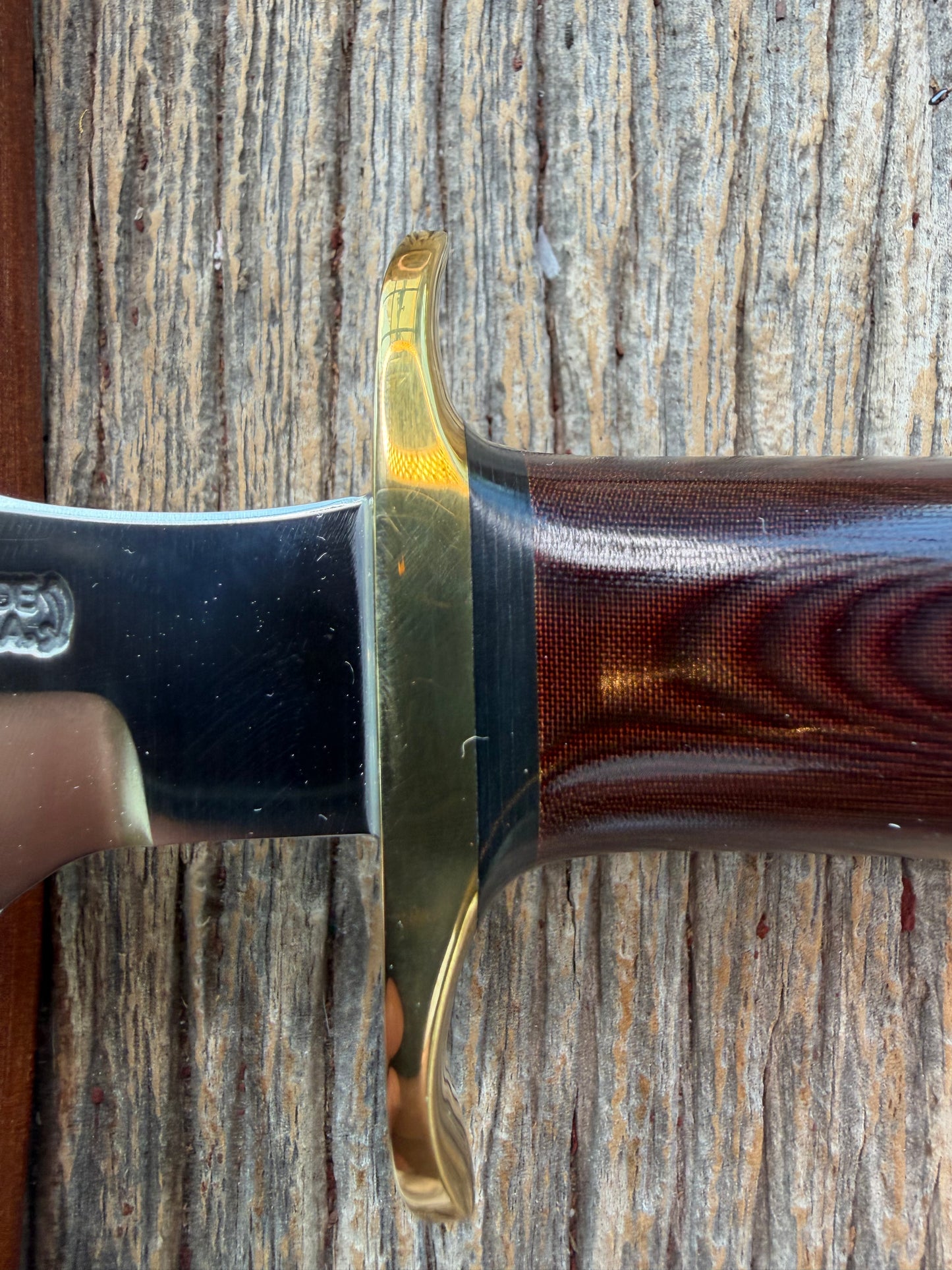 New in Paper Randall Model 1-7 Maroon Micarta Brass Hilt, Natural end, single black spacer, carbon steel.