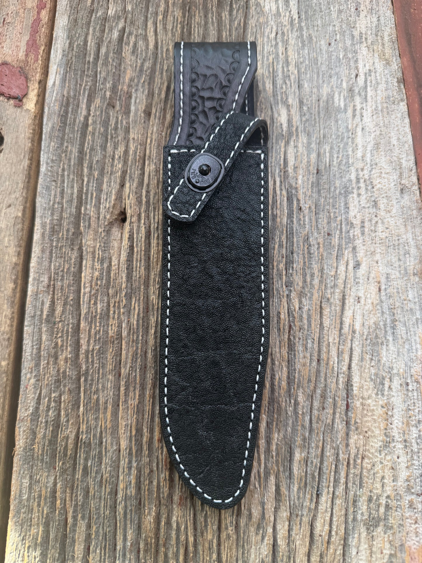 New Randall Model 1-7 Sheath in Exotic thick and textured Black Elephant hide on black leather from Treeman with a black Canteen snap. Hand tooled belt loop. Killer sheath.