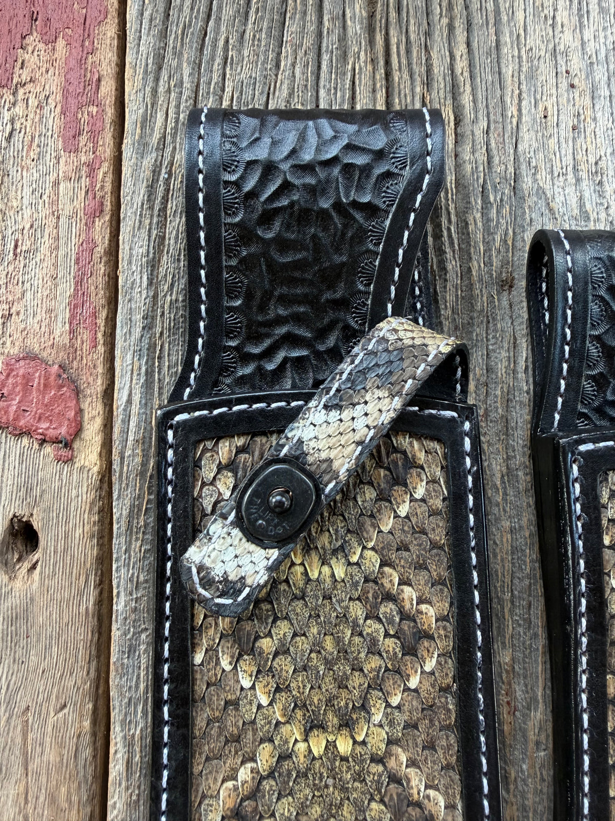 Randall Model Large Sasquatch and Small Sasquatch sheath pair with inlayed Western Diamondback RattleSnake skins from Treeman Sheaths. Very dark skins on brown leather, white deviated stitching and black canteen snaps.