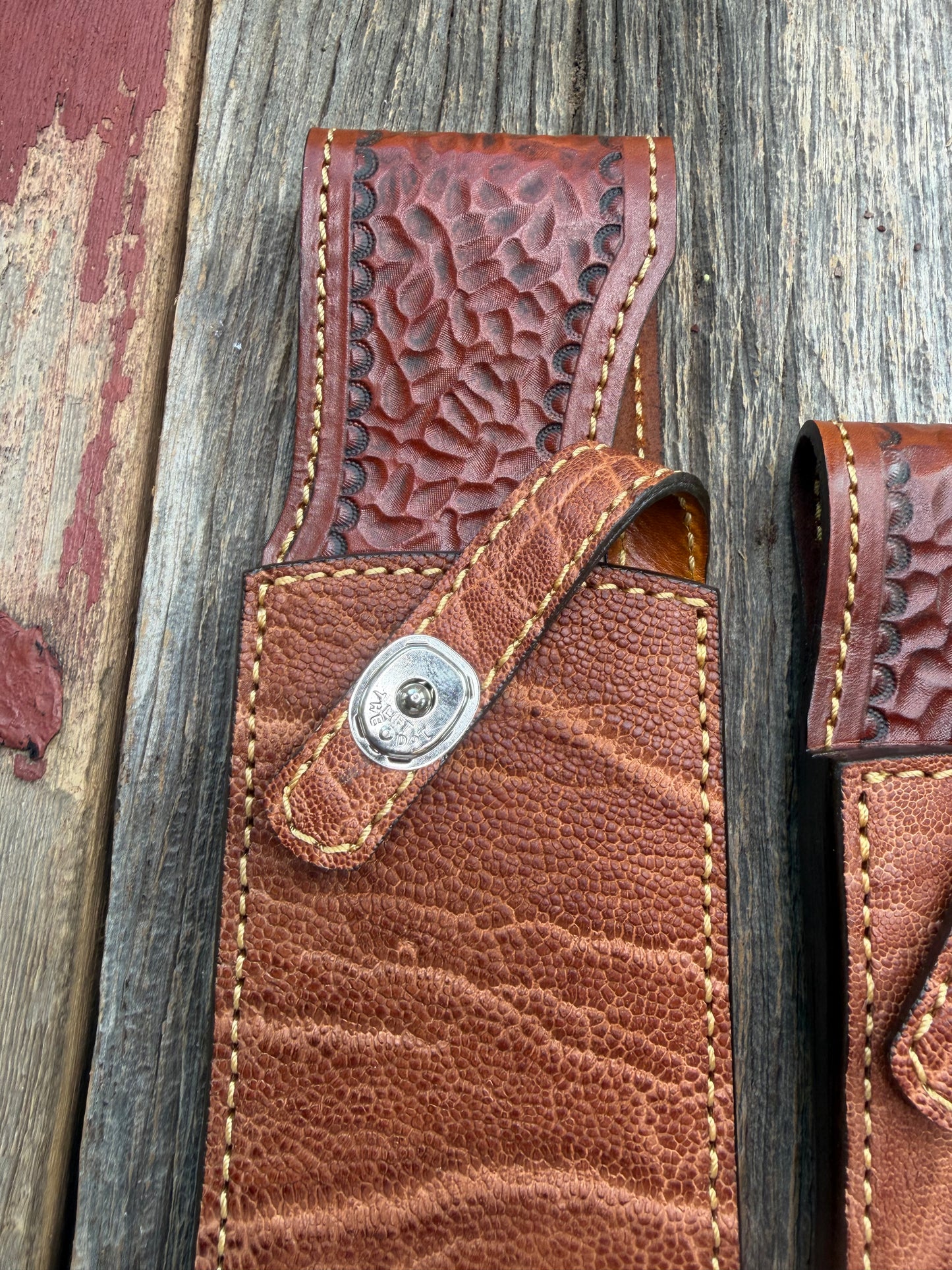 New Randall Model 12-11 Large Sasquatch and 12-8 Small Sasquatch Sheaths in Exotic thick and textured Rust colored Elephant hide on brown leather from Treeman with silver Canteen snaps. Hand tooled belt loop. Killer sheath. Selling as a pair…