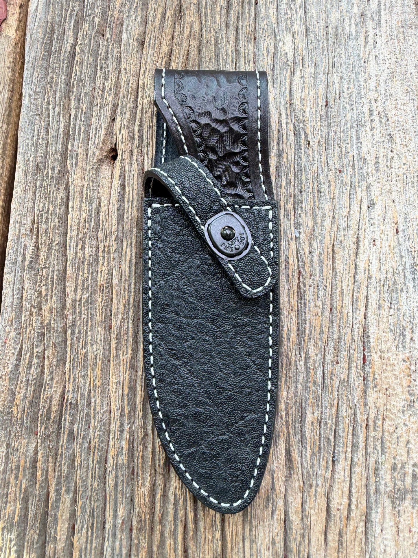 New Randall Model 11-5 Sheath in Exotic thick and textured Black Elephant hide on black leather from Treeman with a black Canteen snap. Hand tooled belt loop. Killer sheath.
