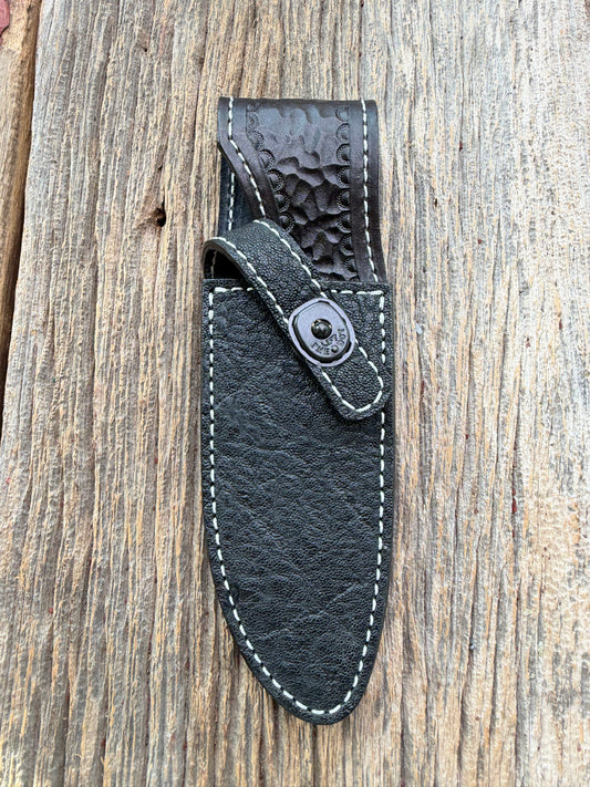 New Randall Model 11-5 Sheath in Exotic thick and textured Black Elephant hide on black leather from Treeman with a black Canteen snap. Hand tooled belt loop. Killer sheath.