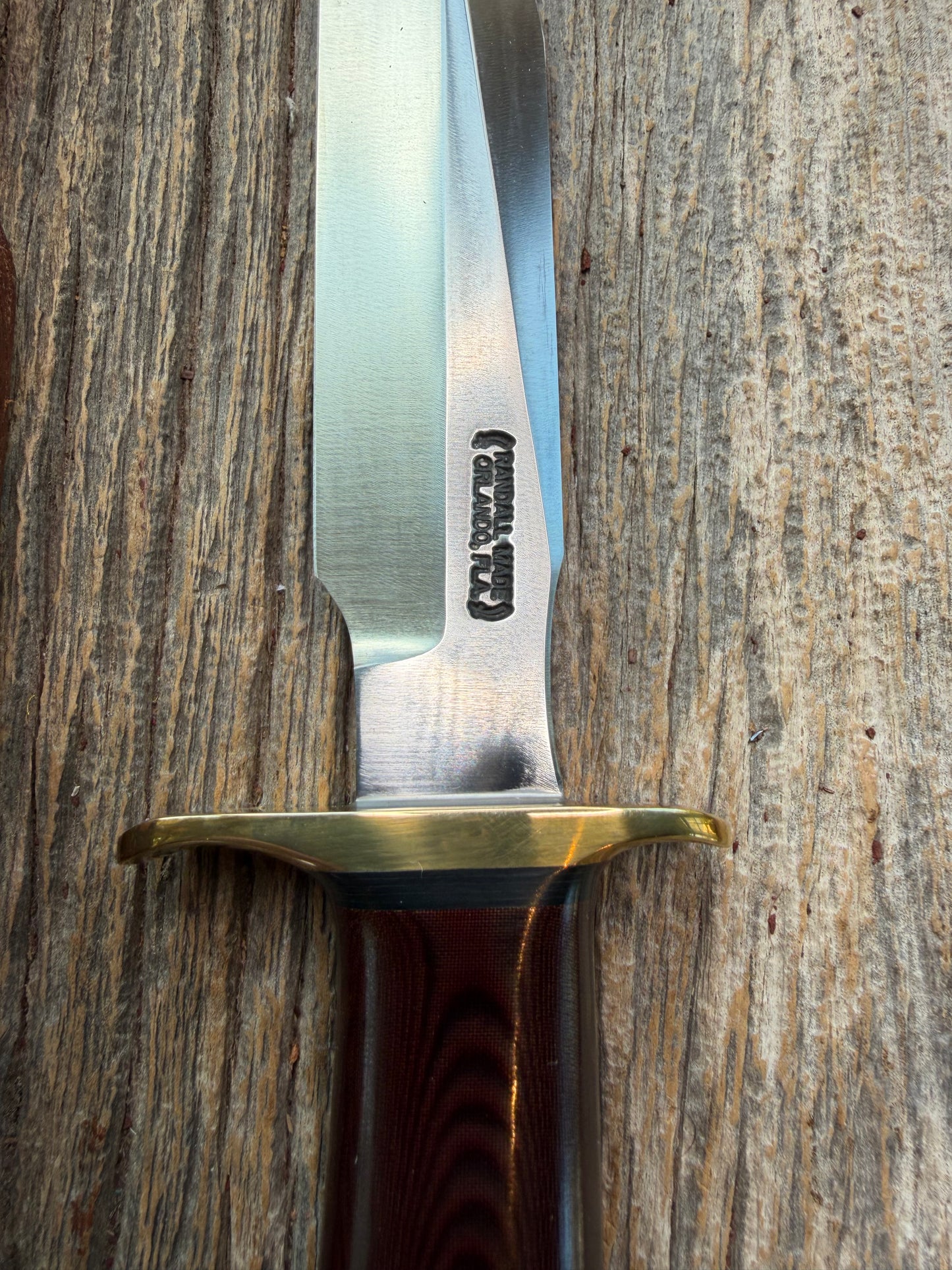 New in Paper Randall Model 1-7 Maroon Micarta Brass Hilt, Natural end, single black spacer, carbon steel.