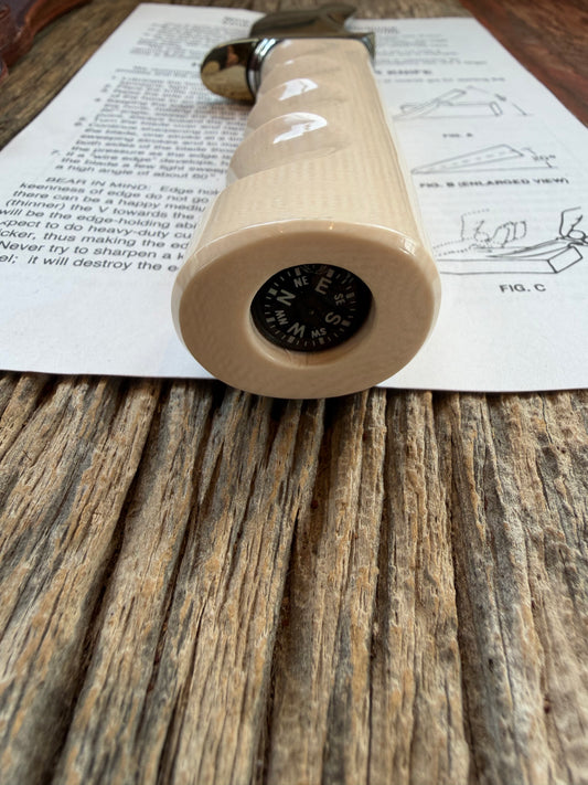 New Randall Model Bowles Skinner # 504 with a Warthers Resin finger grooves handle. Nickel silver Single Hilt and natural end with a compass.