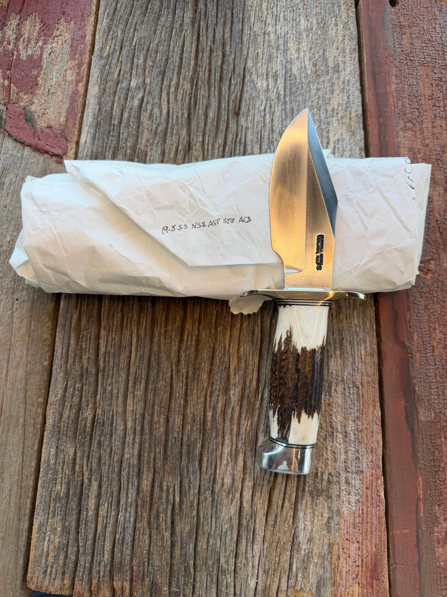 New in Paper Randall Model 19-5 with a Gnarly piece of Stag. Nickel silver Hilt and Aluminum crows beak Butt cap.