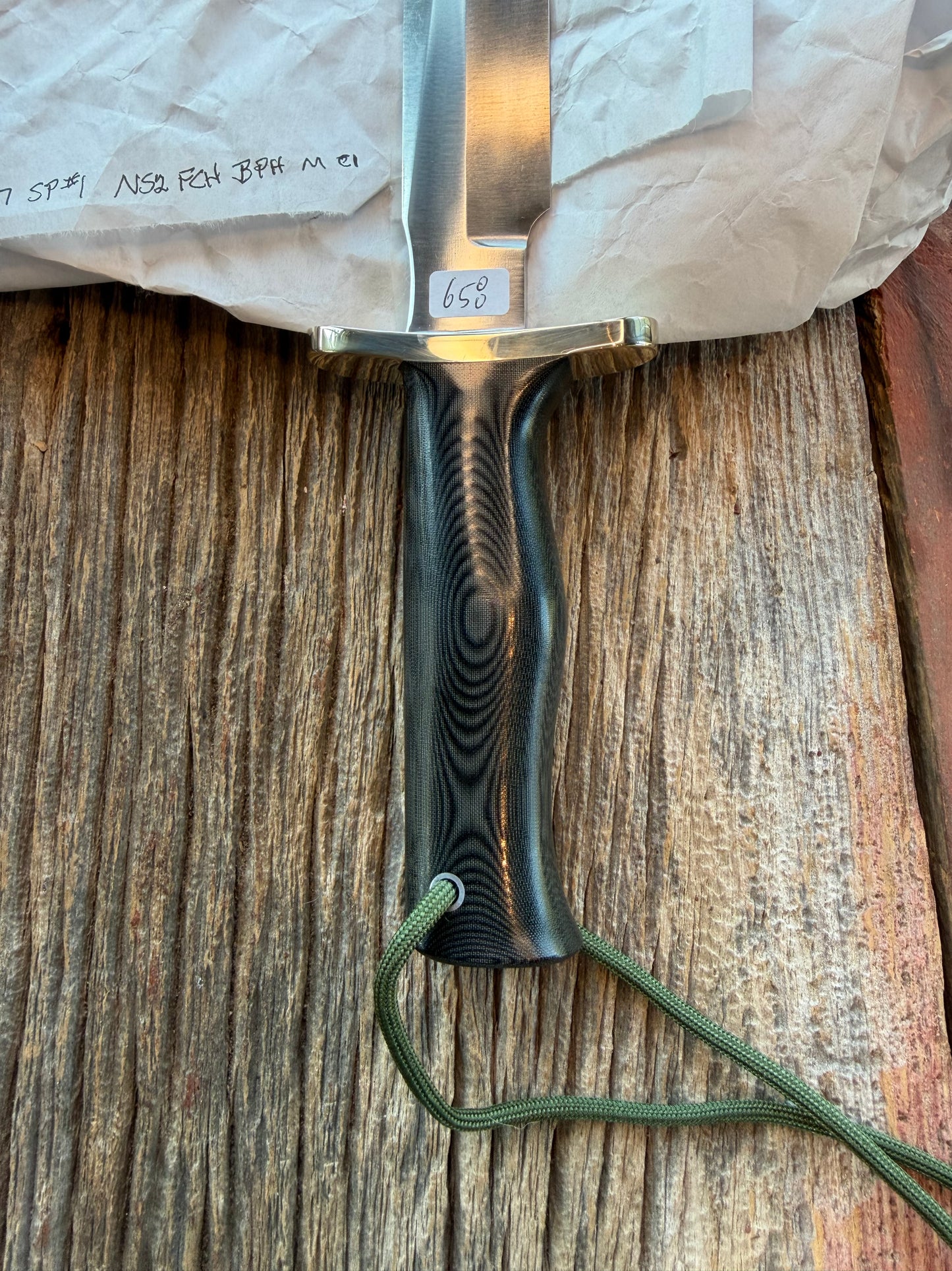 New in Paper Randall Model 16 SP#1 Special fighter with a Black Micarta handle. SS blade, Nickel silver Forward Curved hilt. Lanyard. Brown leather sheath.