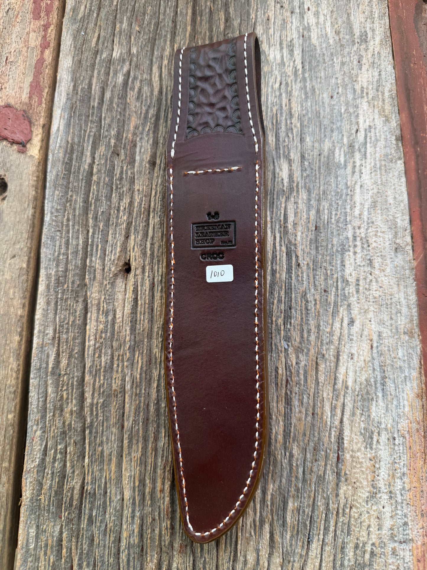 New Randall Model 1-8 Sheath in Exotic thick and textured Honey Crocodile skin on brown leather from Treeman with a silver Canteen snap. Hand tooled belt loop. Killer sheath.