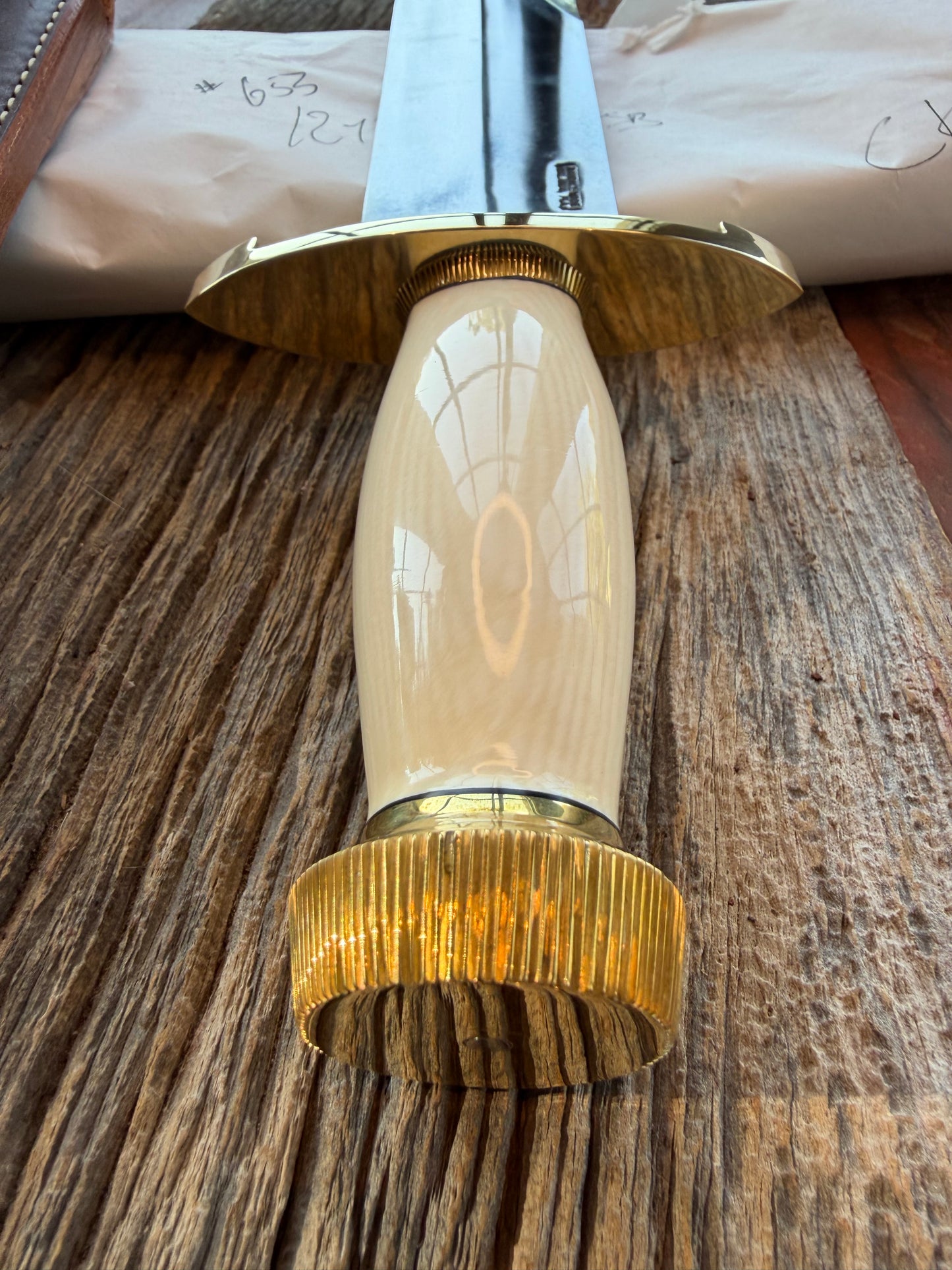 New in Paper Model 12-11 Smithsonian “ Smitty” Beautiful Dave Warthers Resin with a Brass Lugged hilt and Scalloped brass collar and scalloped coolie butt cap.